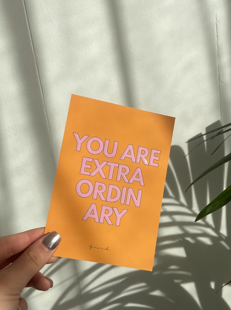 A beautifully designed greeting card with embossed text saying 'You Are Extraordinary', featuring a matching envelope.