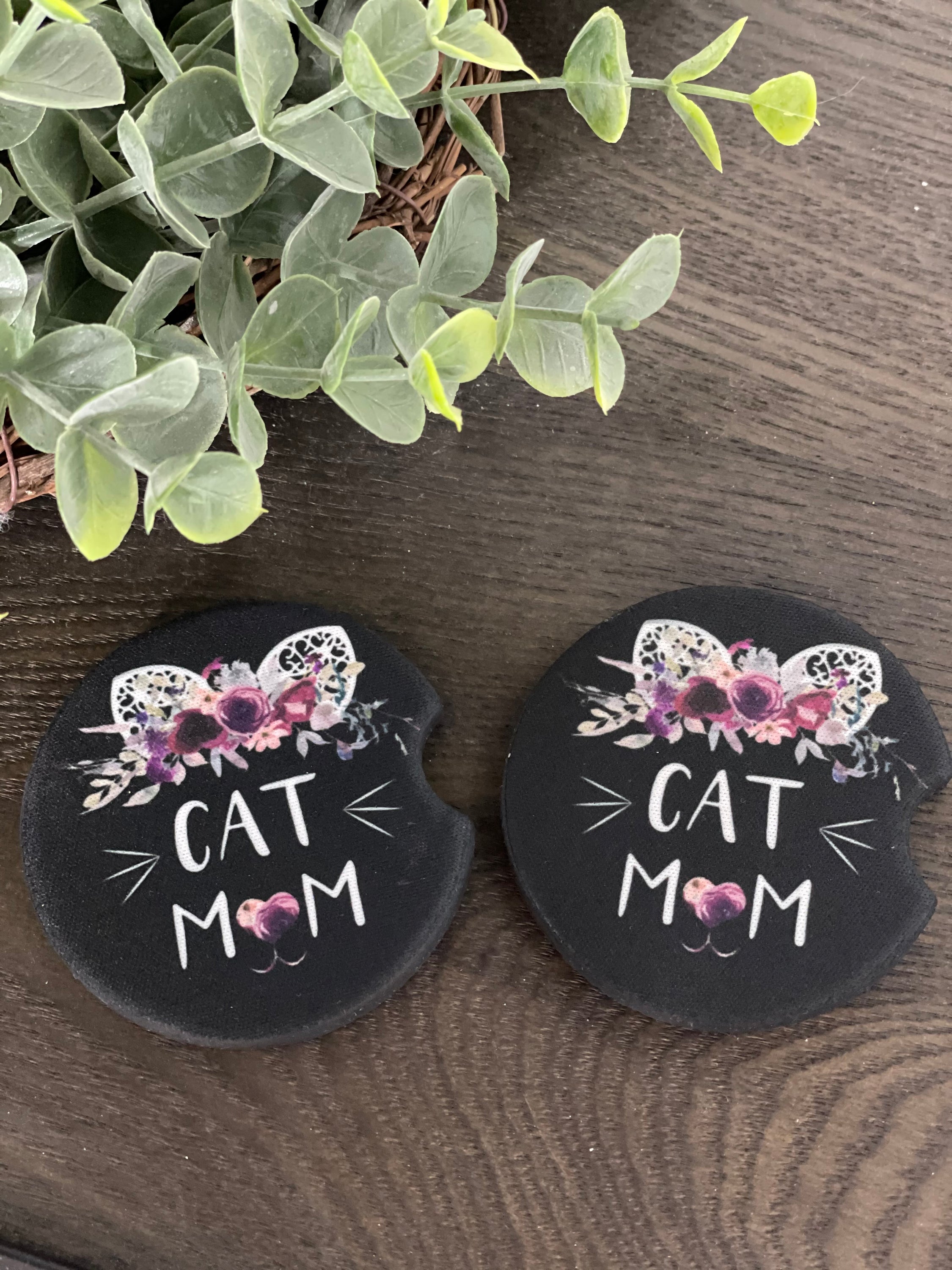 A stylish Cat Mom Neoprene Car Coaster Set featuring a charming cat design, perfect for car cup holders.