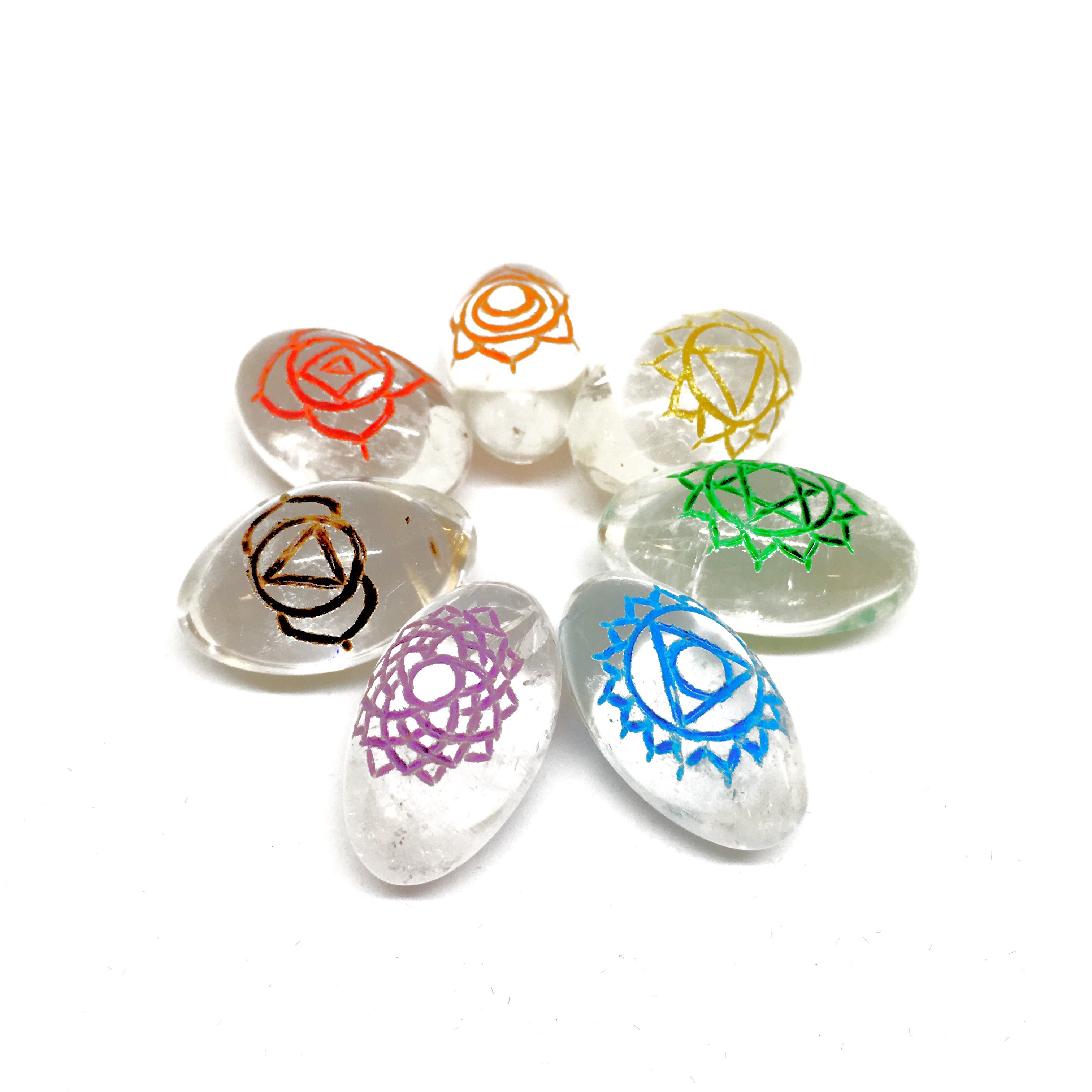 Seven chakra symbols on crystals.