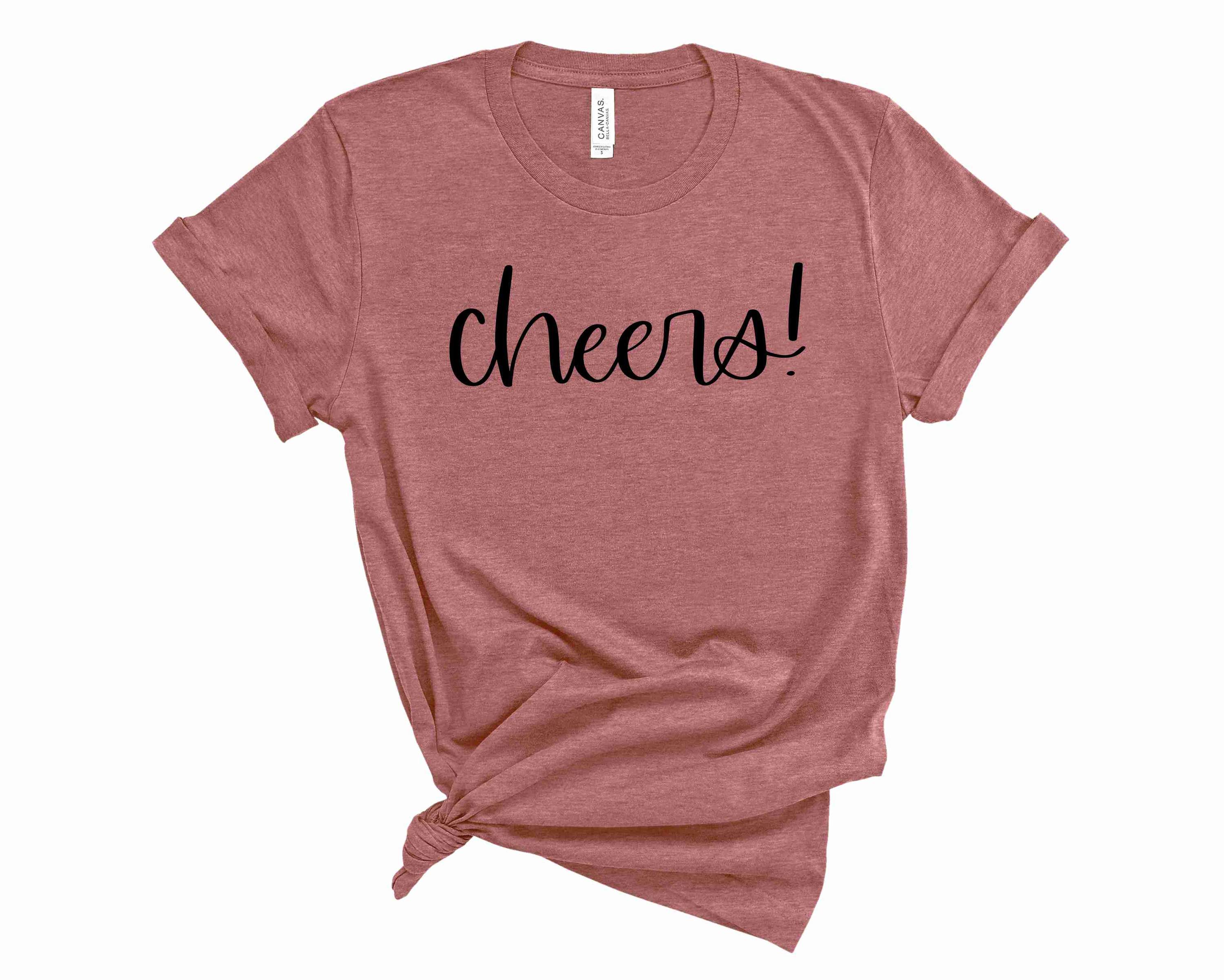 Cheers Graphic Tee featuring a stylish unisex design in soft fabric.