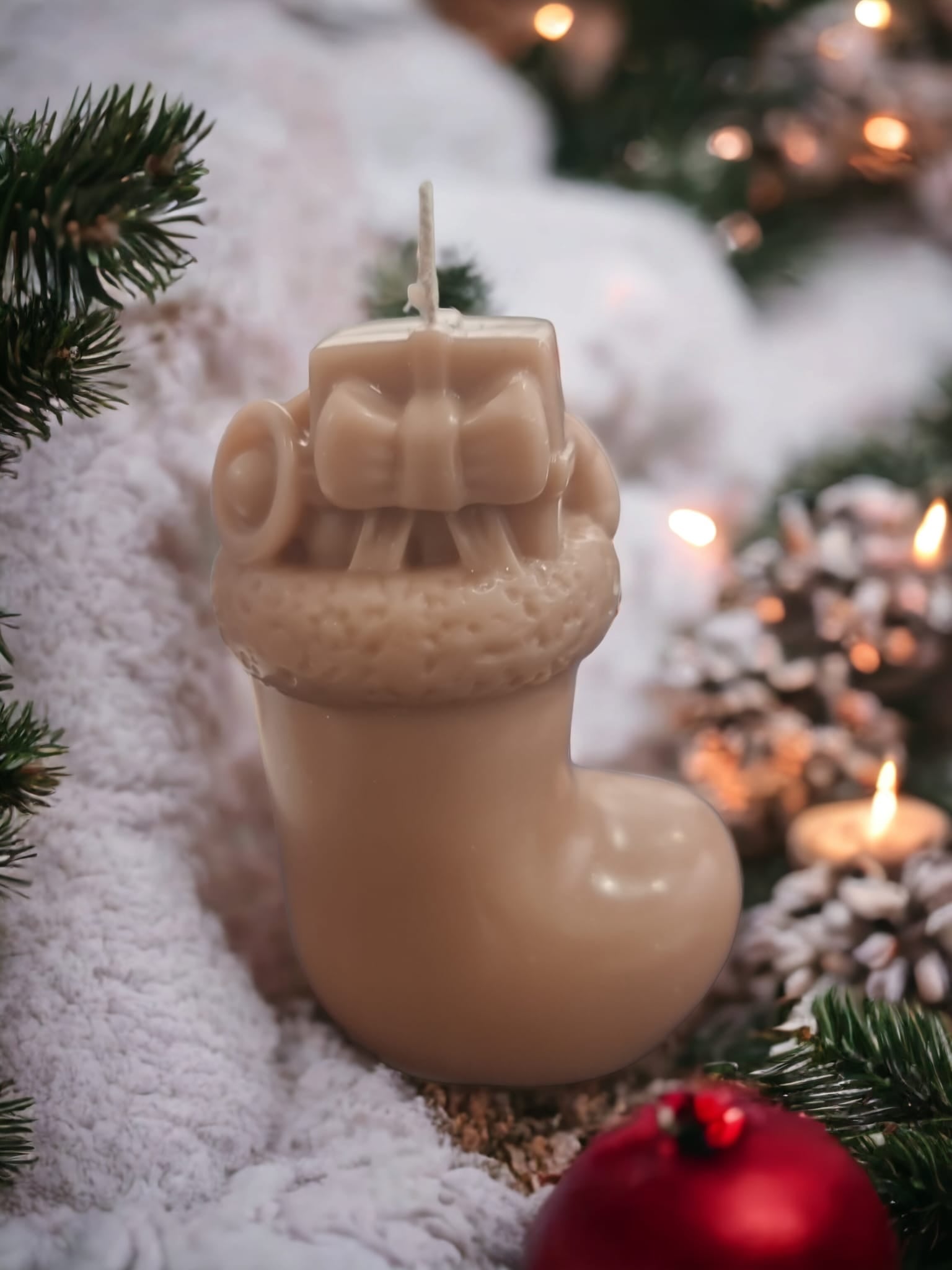 A festive Christmas Boot Salted Pumpkin Scent Candle in a charming boot shape, exuding warm pumpkin spice aroma, perfect for holiday decor.