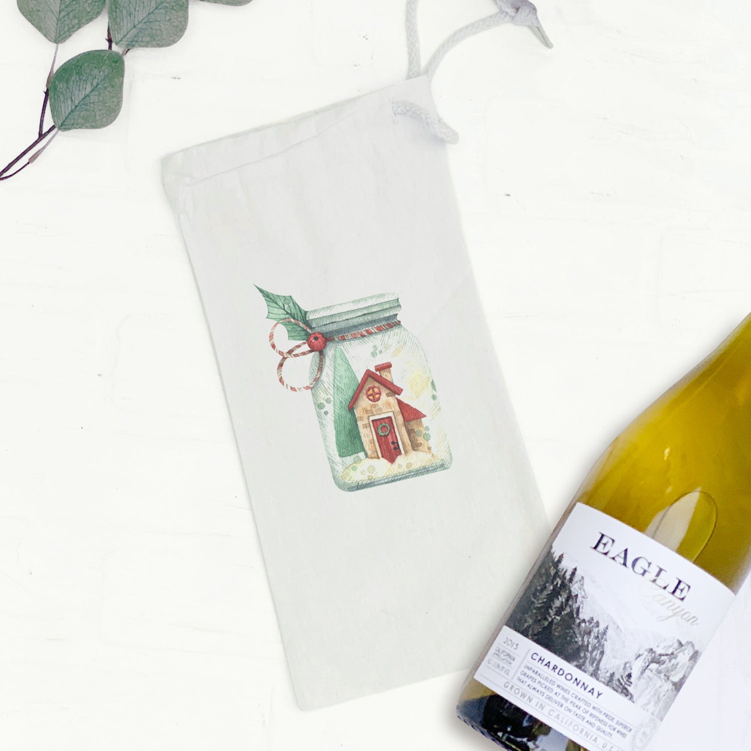 A festive Christmas Snow Jar canvas wine bag featuring a snow design, perfect for holding a 750mL wine bottle.