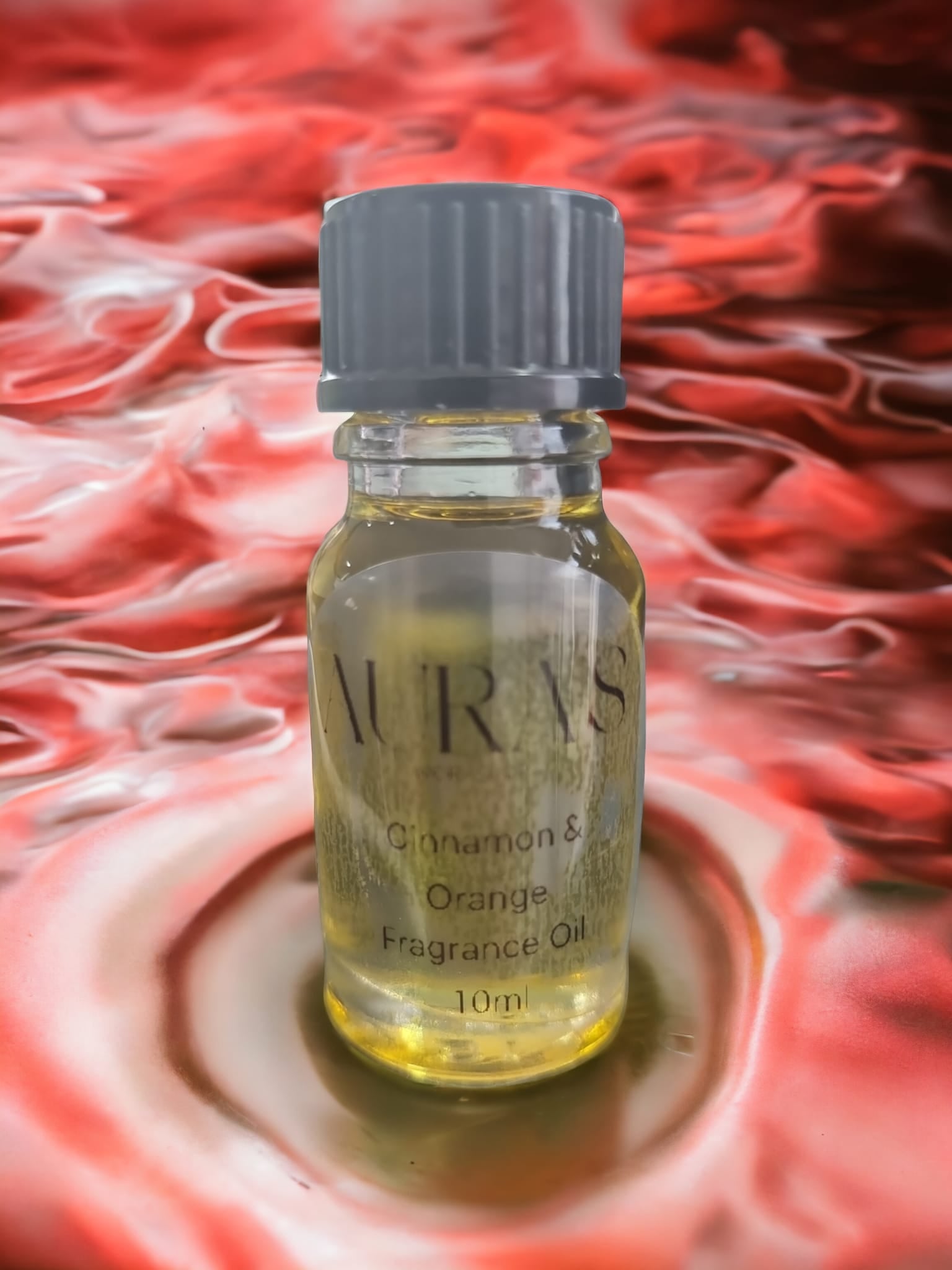 10ml bottle of Cinnamon & Orange Fragrance Oil with a warm and inviting aroma, perfect for DIY projects and home fragrance.
