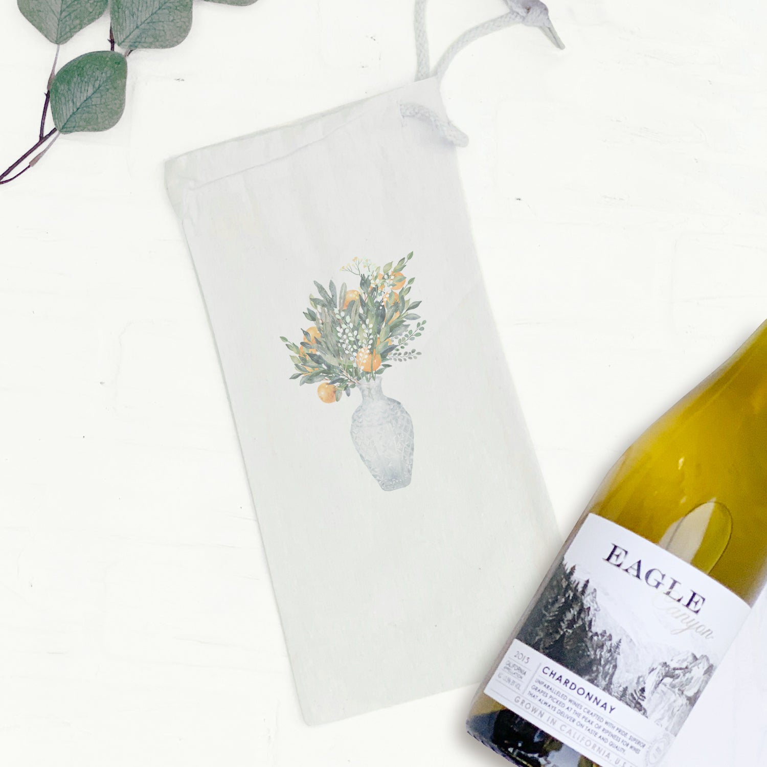 Citrus Vase Canvas Wine Bag featuring a stylish design with a drawstring closure, perfect for holding a 750mL wine bottle.