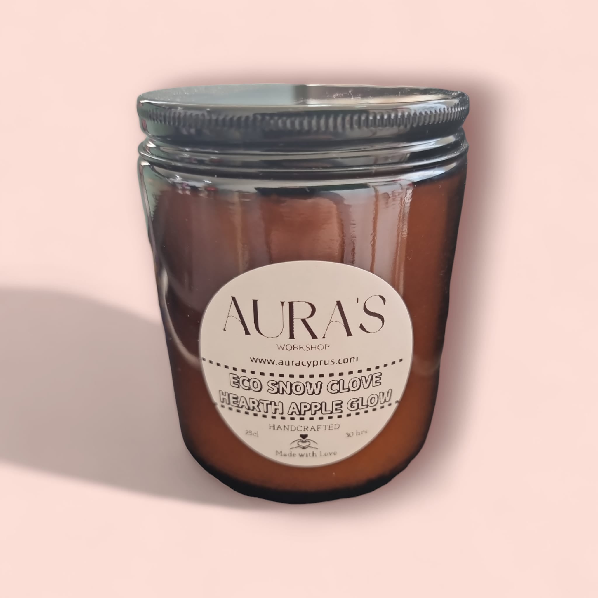 Clove Hearth Apple Glown Scent Eco Snow Candle in a stylish glass container, showcasing its eco-friendly design and warm, inviting colors.