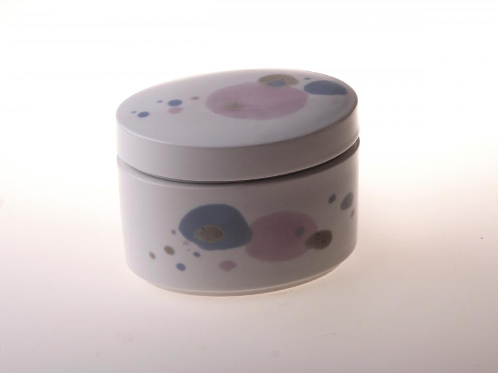 A beautifully crafted porcelain box with vibrant floral designs, measuring 10 cm in length and 3 cm in height.