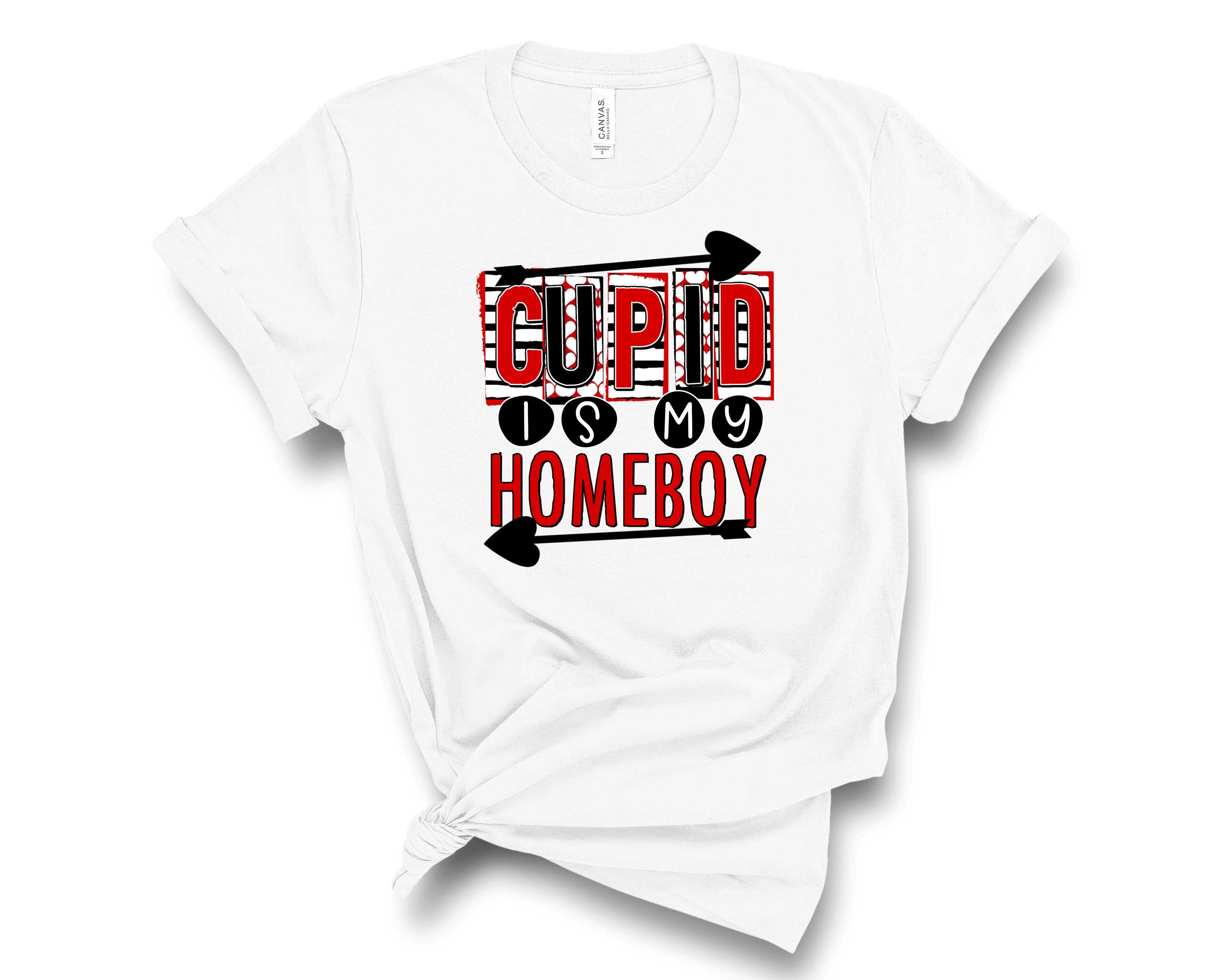 A unisex graphic tee featuring the playful text 'Cupid is my homeboy' in bold letters, perfect for casual wear.