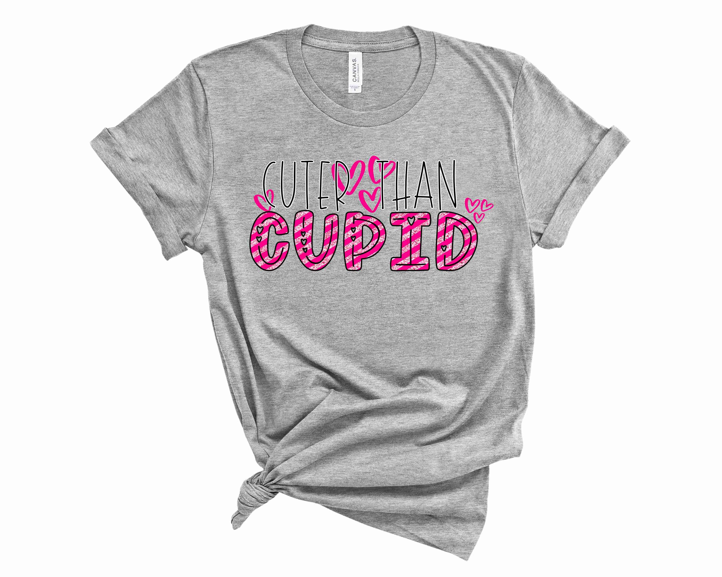 Cuter than Cupid Graphic Tee featuring a playful design with vibrant colors, suitable for unisex wear.