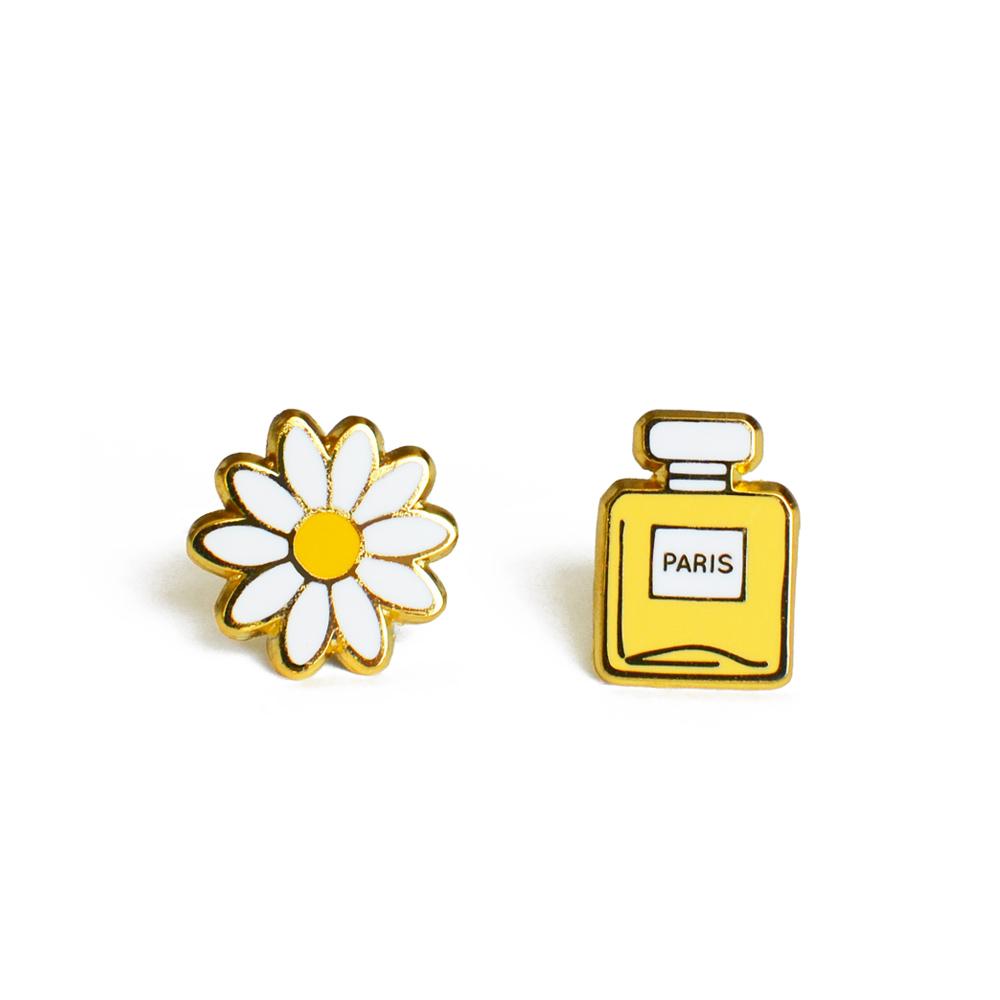 Daisy & Perfume Earrings featuring a charming design with high-quality hard enamel and a butterfly stopper, presented on a backing card.