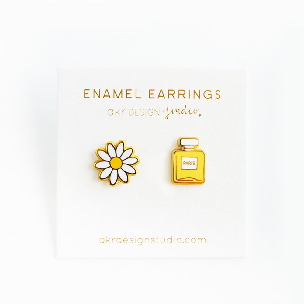 Daisy & Perfume Earrings featuring a charming design with high-quality hard enamel and a butterfly stopper, presented on a backing card.