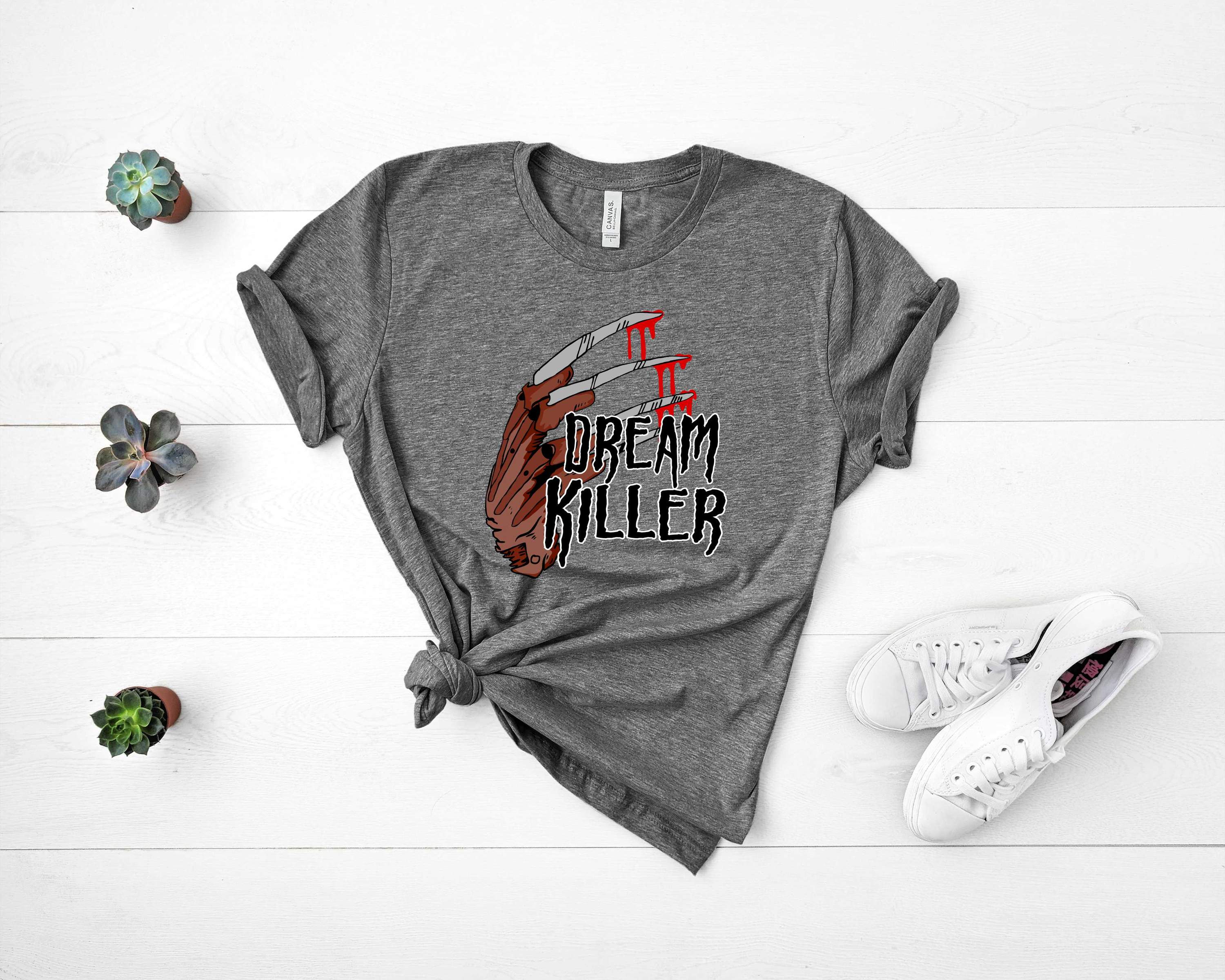 Dream Killer Graphic Tee featuring bold design on a soft Bella Canvas fabric, suitable for unisex wear.