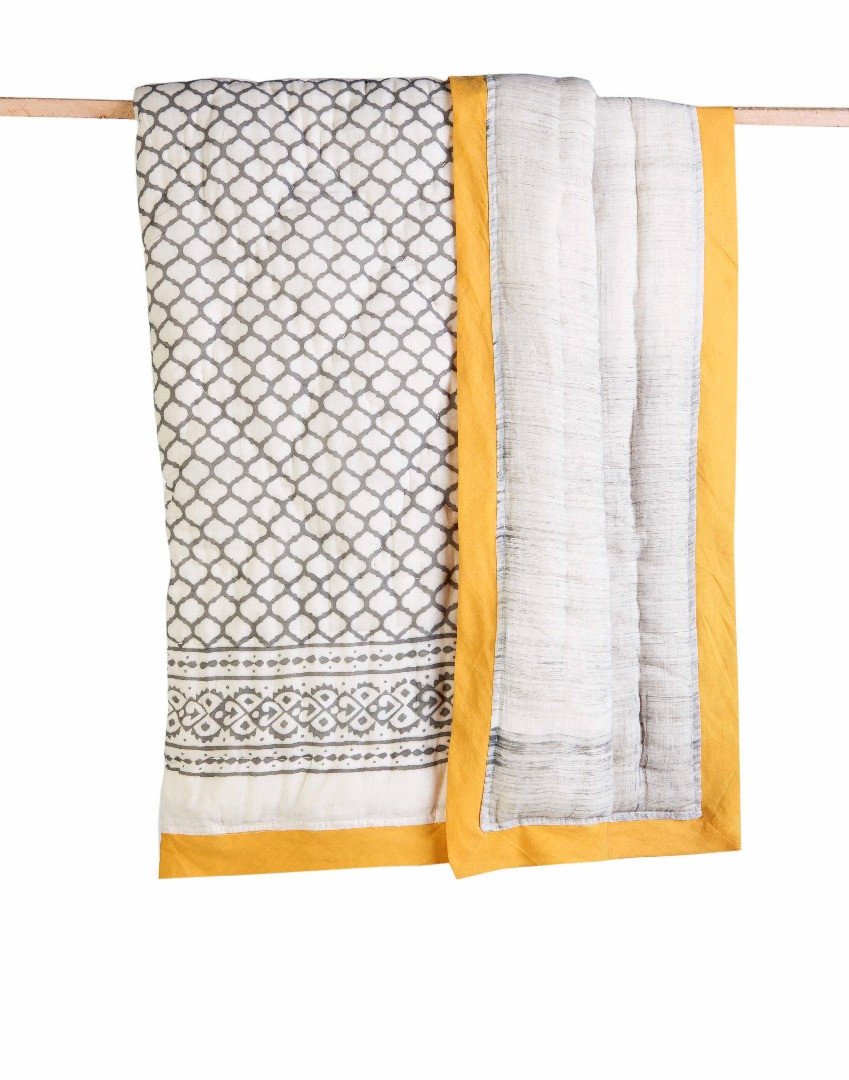 ERAWAN Cotton Quilt featuring soft cotton voile exterior, unique hand-stitched designs, and reversible patterns, handcrafted in India.