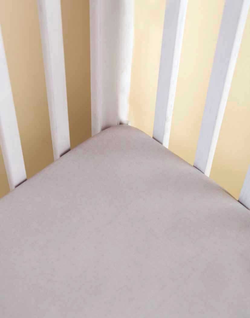 ERAWAN Fitted Crib Sheet made from ultra-soft cotton voile, featuring concealed elastic and deep pocket design for a snug fit.