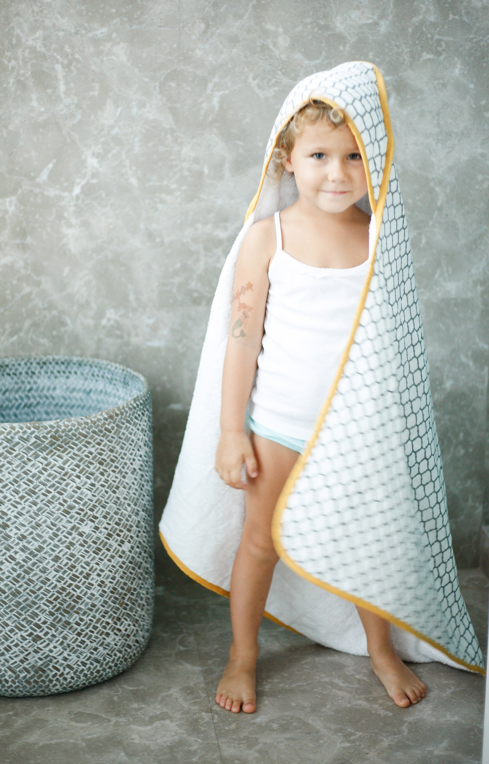 ERAWAN Towel featuring unique block-print design, made from soft cotton voile and plush terry, perfect for newborns to 4 years old.