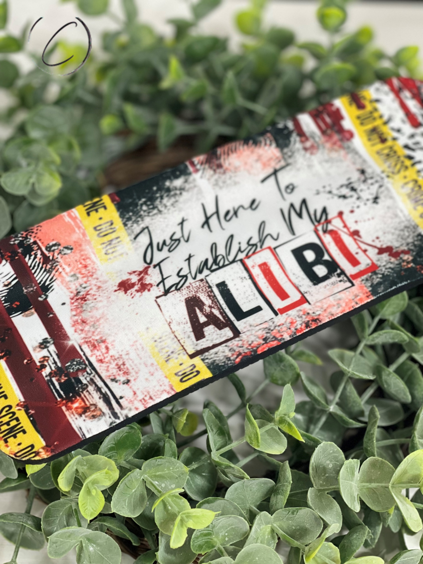 Establish My Alibi Slap Wrap Can Cooler in vibrant colors, designed to fit 12oz cans and bottles, made of durable neoprene material.