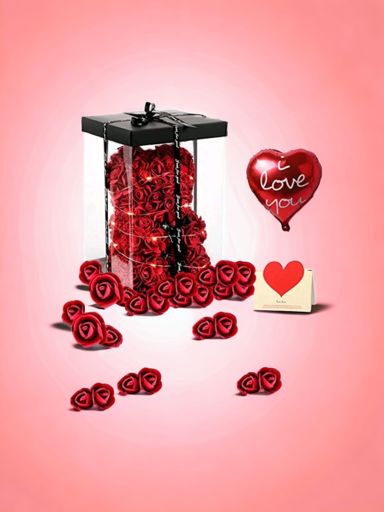 Eternal Love Red Rose Bear Gift Set featuring a bear made of foam roses, a colorful balloon, twinkling lights, and a heartfelt card in an elegant gift box.