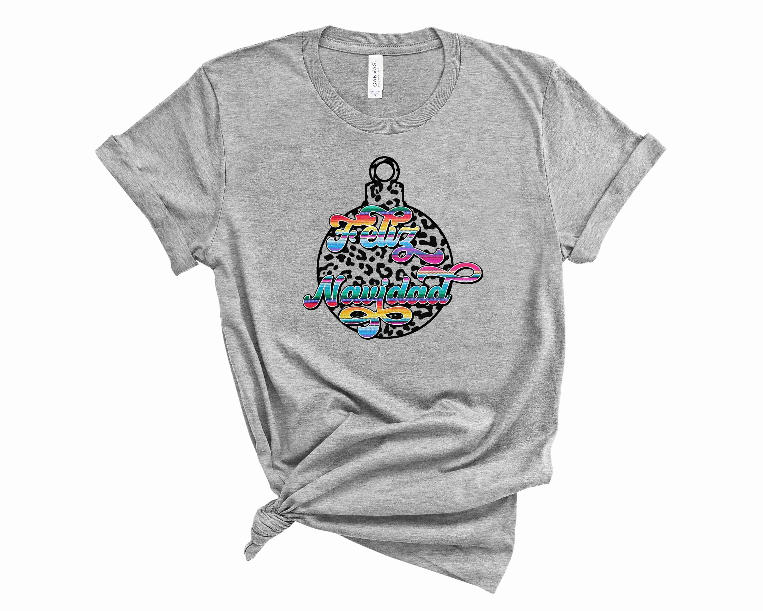 Feliz Navidad Ornament Graphic Tee featuring festive design in vibrant colors, suitable for unisex wear.