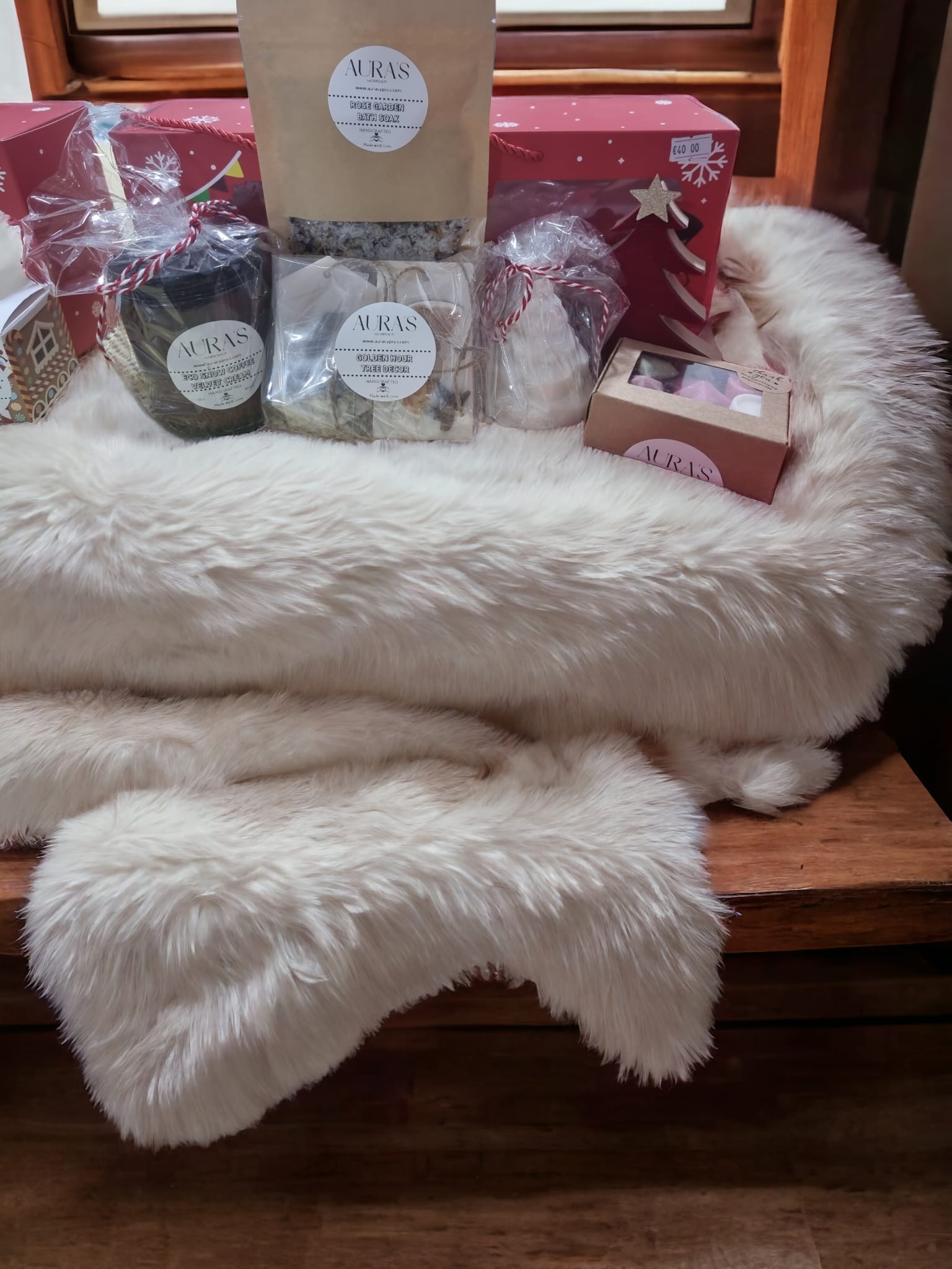 Festive Wonderland Collection gift box featuring scented candles, wax melts, bath salts, artisanal soaps, and decorative elements for the holiday season.