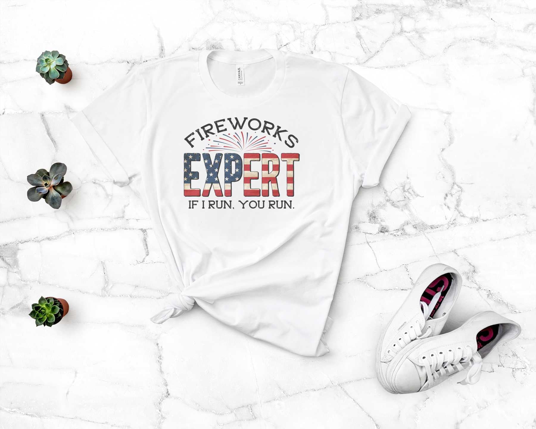 A unisex graphic t-shirt featuring a vibrant fireworks design, perfect for enthusiasts.