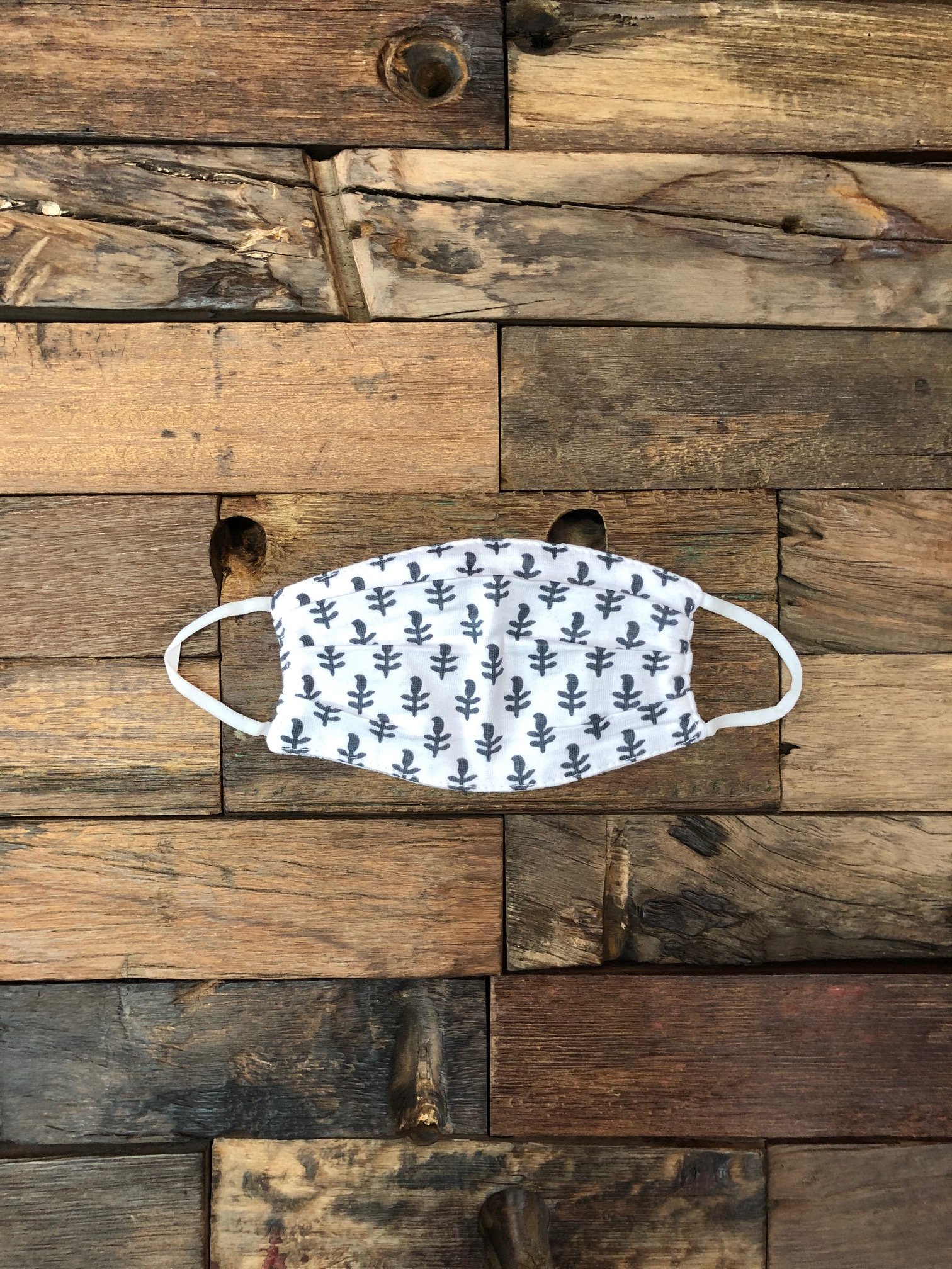 Fort Blue Reusable Teen/Women's Face Mask made from up-cycled organic cotton, featuring a reversible design and soft elastic for comfort.