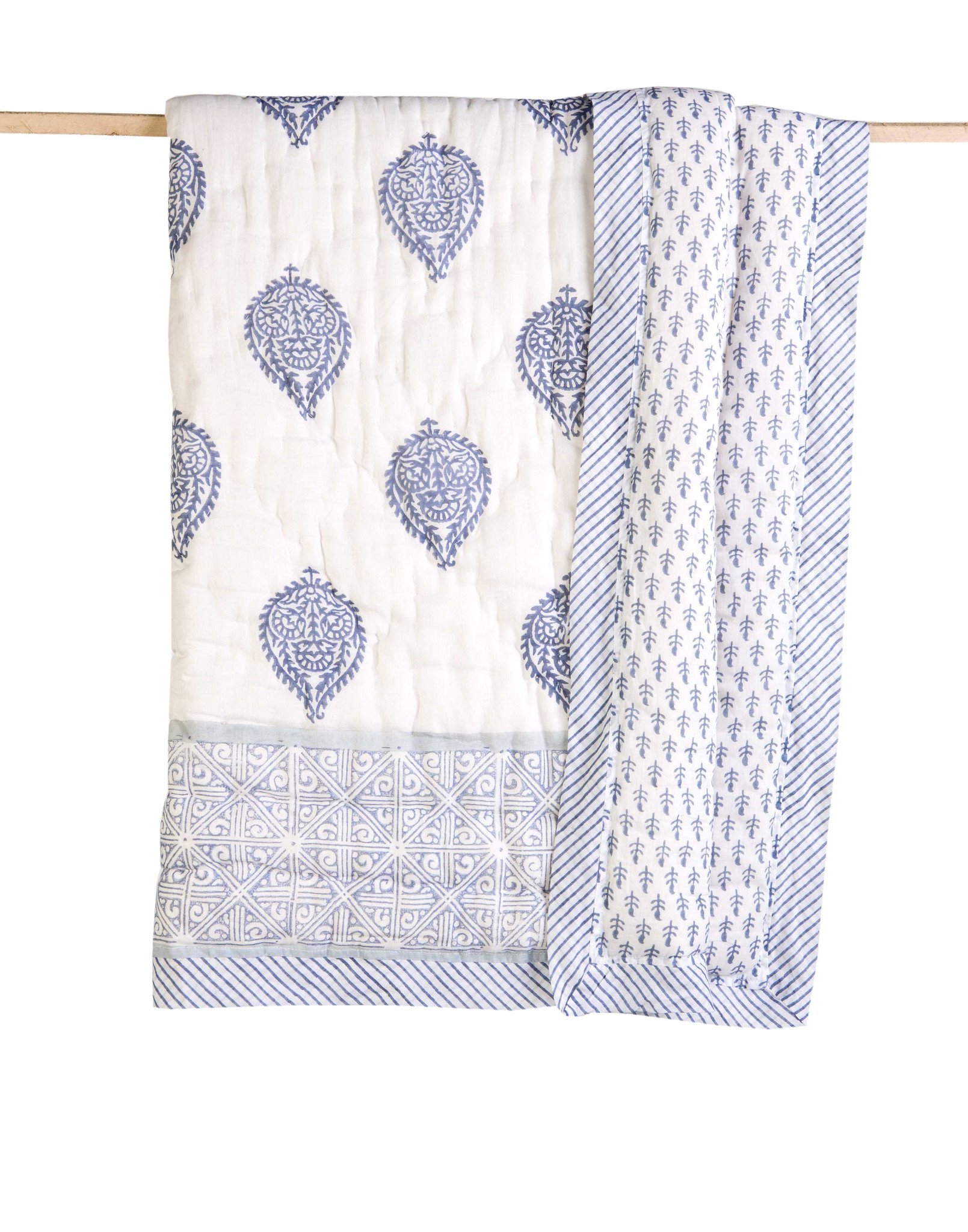 FORT Cotton Quilt featuring soft cotton voile exterior and unique hand-stitched designs, showcasing its reversible pattern.