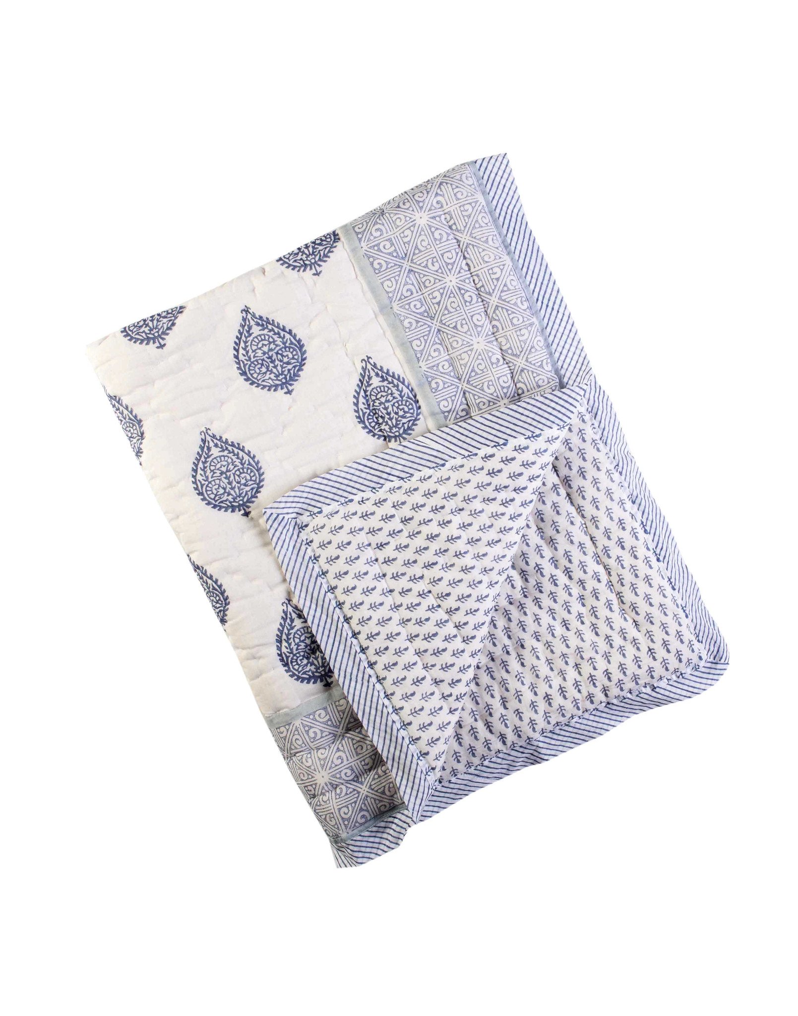 FORT Cotton Quilt featuring soft cotton voile exterior and unique hand-stitched designs, showcasing its reversible pattern.