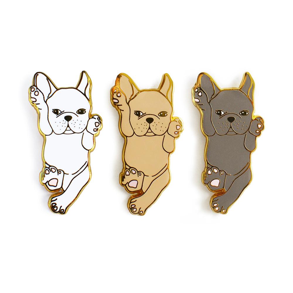 White French Bulldog enamel pin on a backing card, showcasing its cute design and high-quality finish.