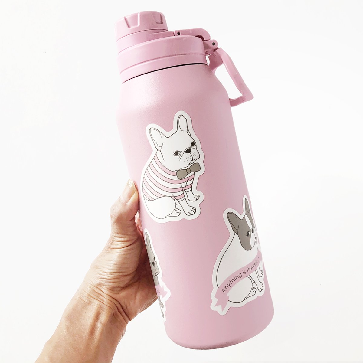 Adorable French Bulldog waterproof sticker on a smooth surface, showcasing its vibrant design and quality.