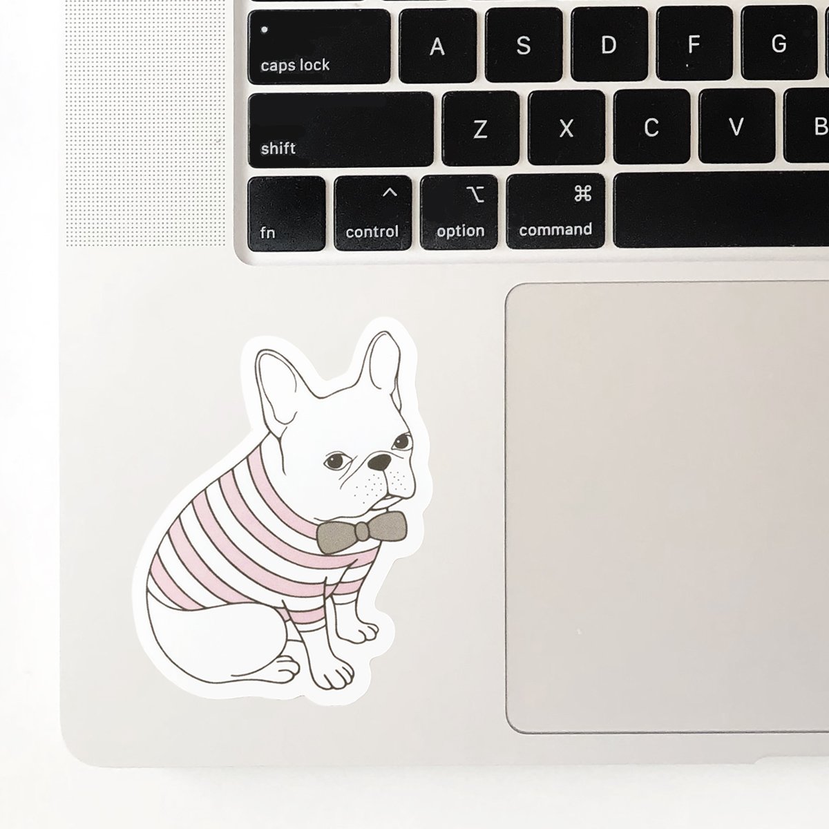 Adorable French Bulldog waterproof sticker on a smooth surface, showcasing its vibrant design and quality.