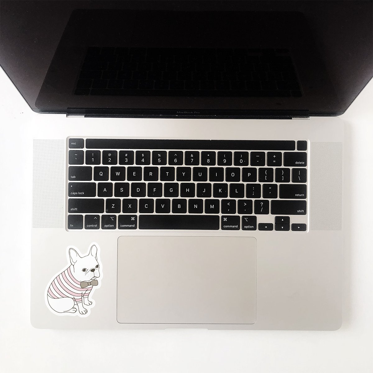 Adorable French Bulldog waterproof sticker on a smooth surface, showcasing its vibrant design and quality.