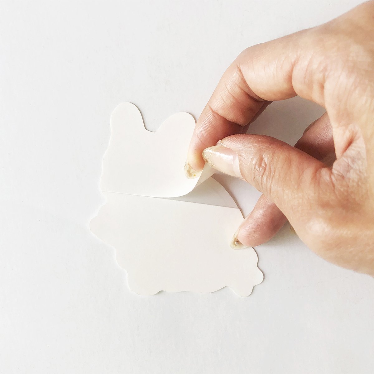 Adorable French Bulldog waterproof sticker on a smooth surface, showcasing its vibrant design and quality.