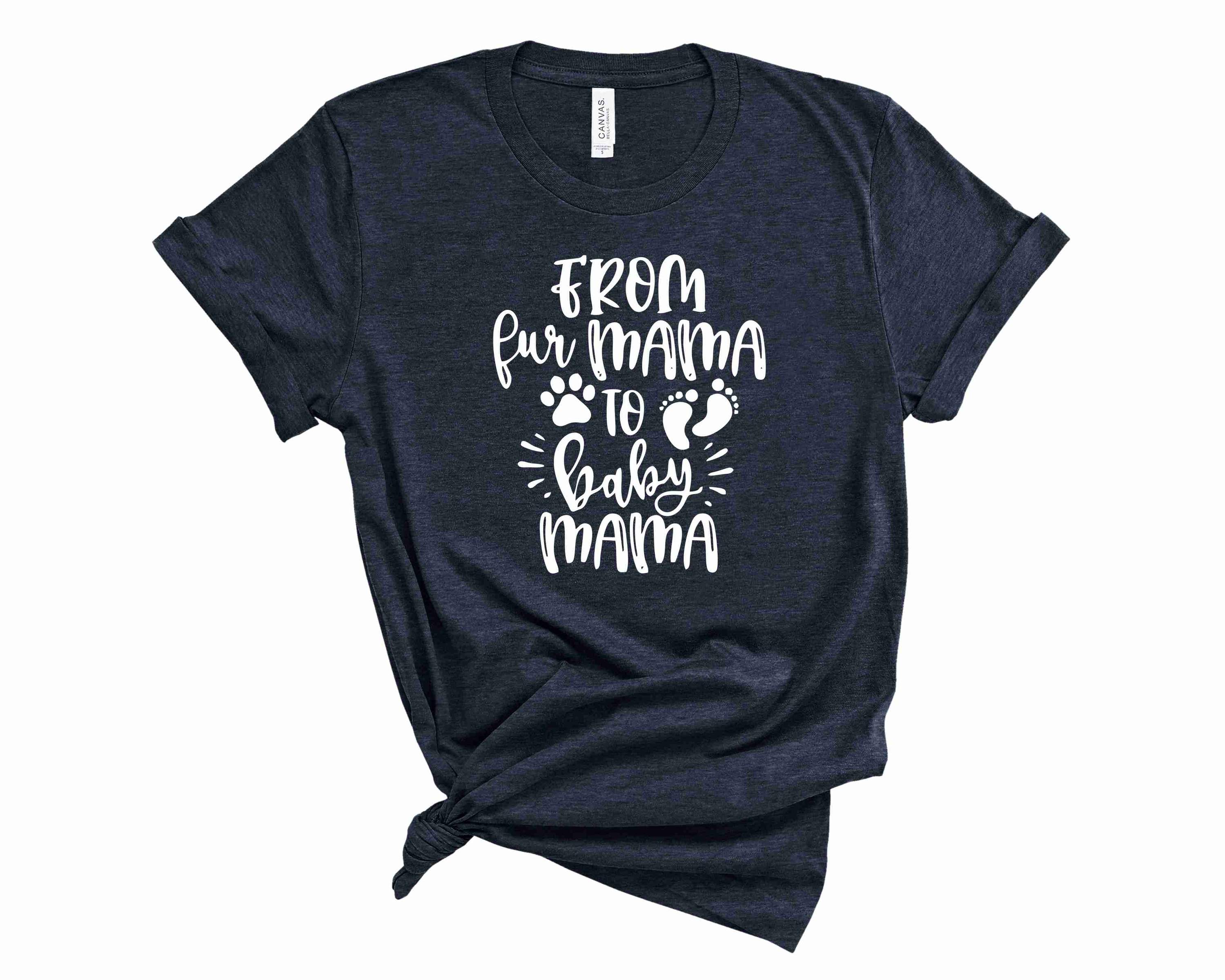 A stylish unisex graphic tee with the phrase 'From Fur Mama to Baby Mama' printed on it, showcasing a trendy design for mothers.
