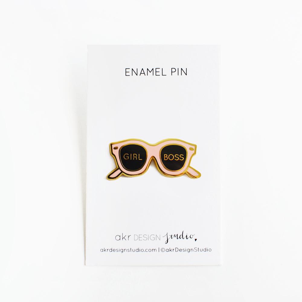 Girl Boss Pink Sunglasses Enamel Pin on a backing card, showcasing vibrant pink color and stylish design.