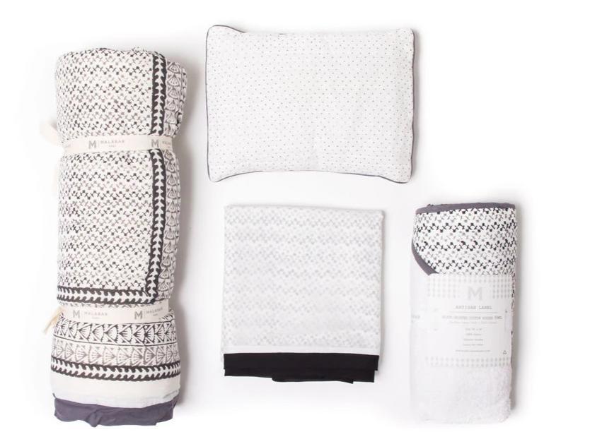 Going Home Newborn Bed + Bath Gift Set featuring a quilt, blanket, towel, and pillow, all made from luxurious cotton voile.