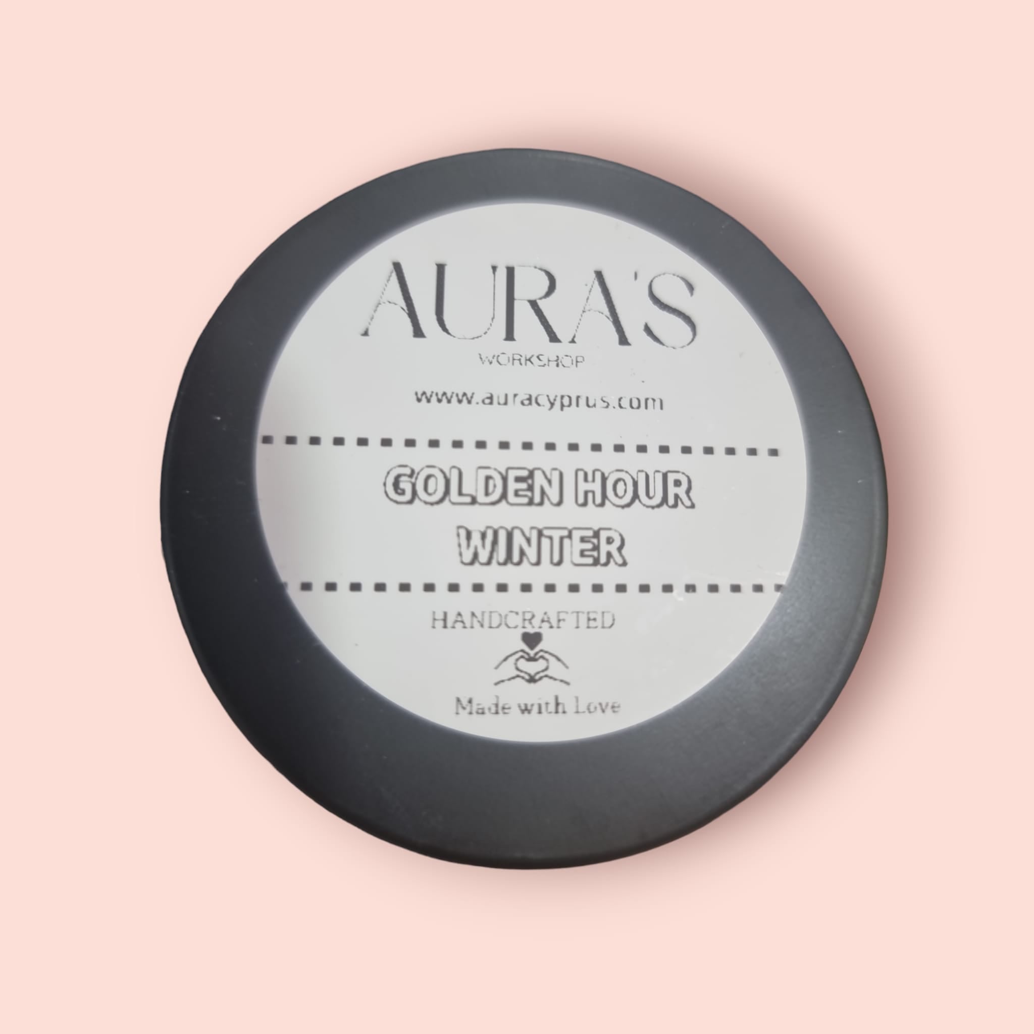 Golden Hour Winter Candle Tin with a warm glow, showcasing its stylish design and inviting fragrance.