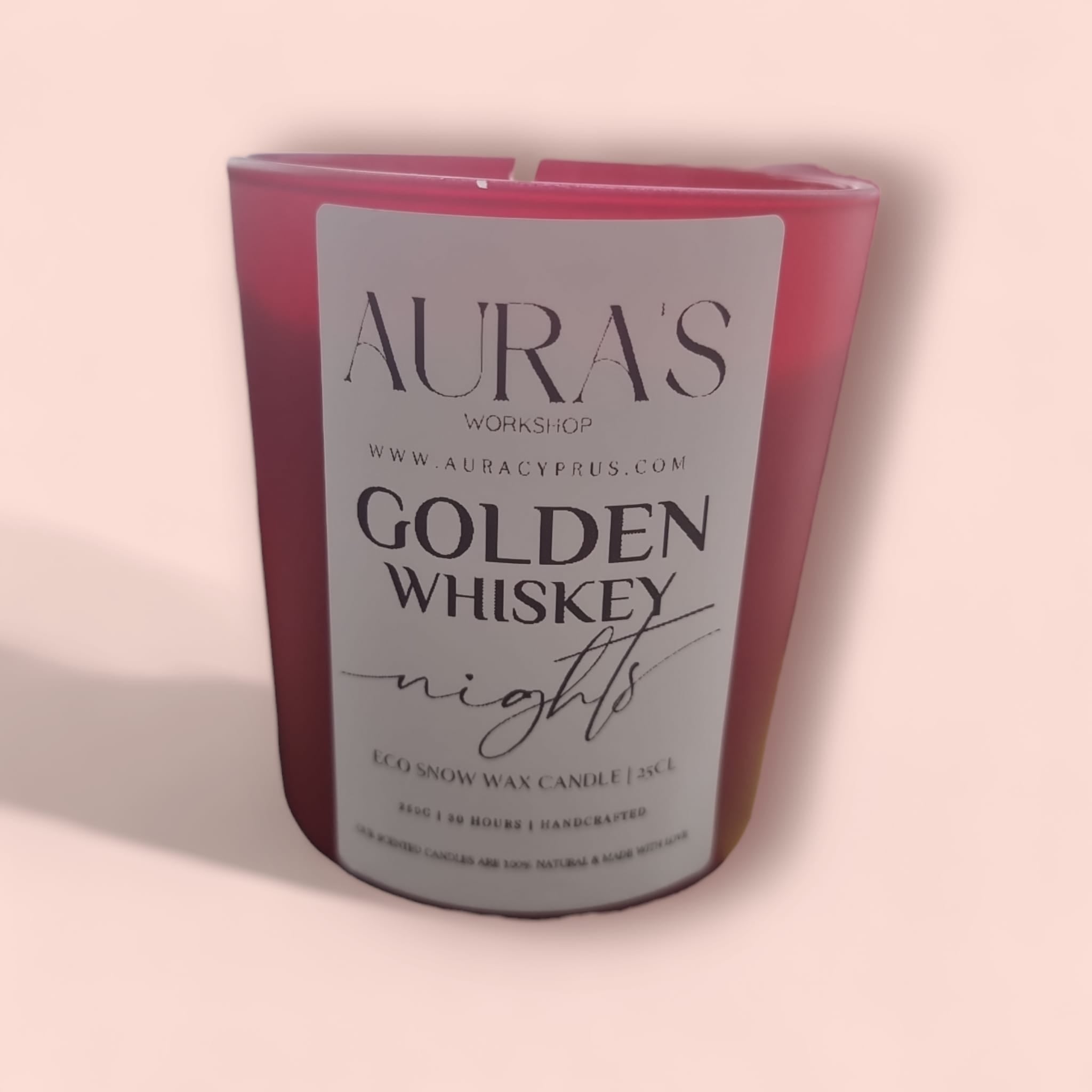 Golden Whiskey Nights Eco Snow Candle in a red matt glass jar, showcasing its elegant design and inviting aroma.