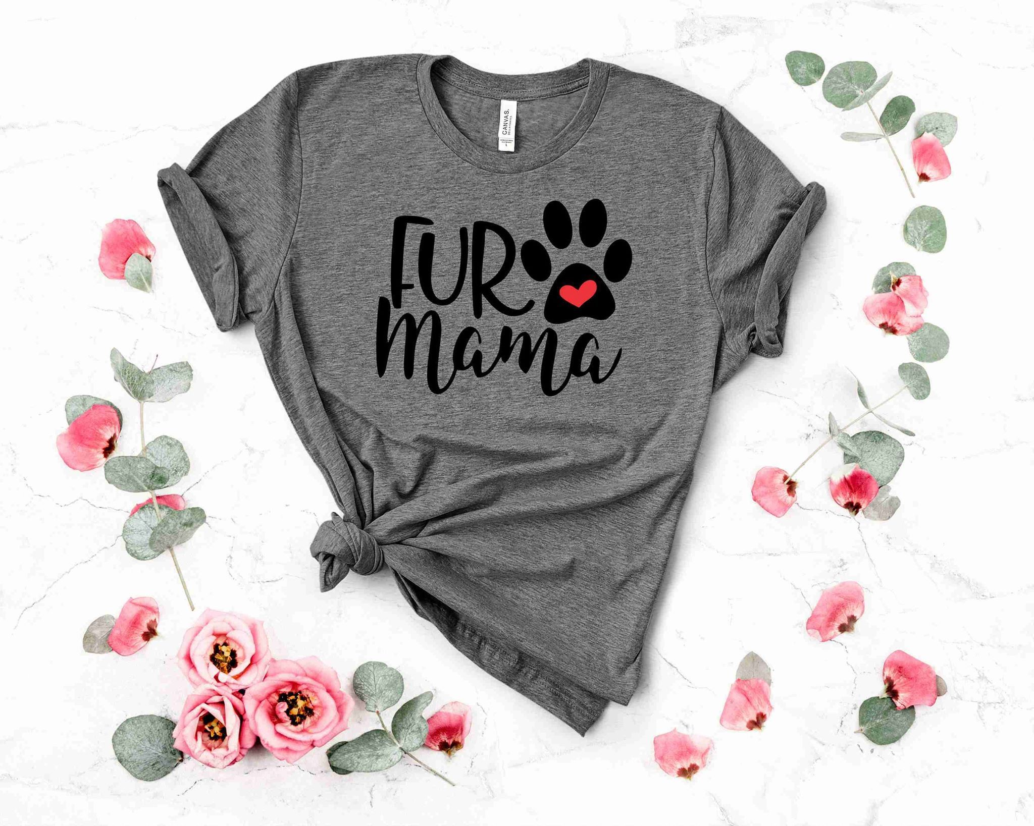 Fur Mama graphic t-shirt displayed on a hanger, showcasing its stylish design and soft fabric.