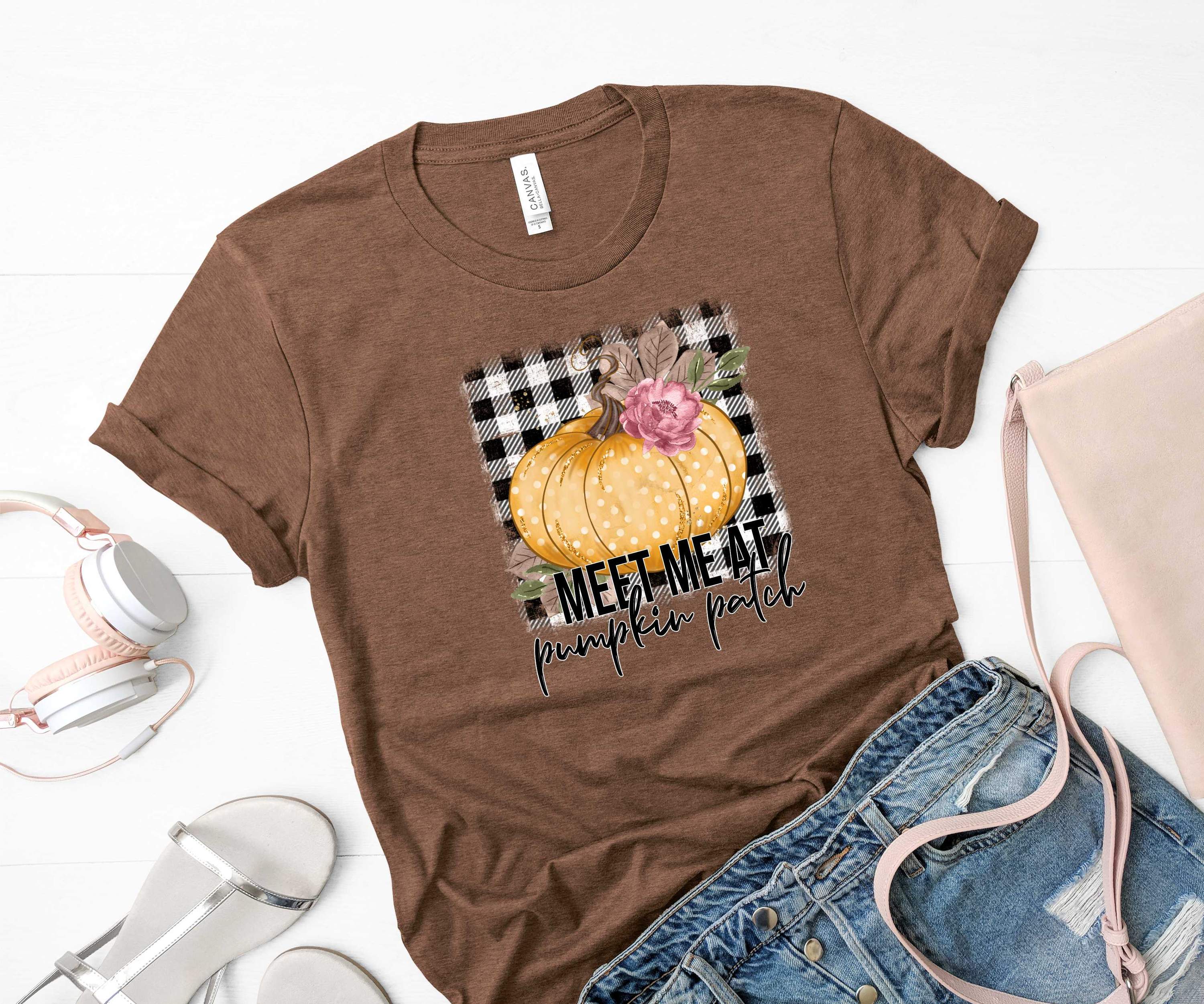 Unisex Graphic T-Shirt featuring 'Meet me at the Pumpkin Patch Plaid' design, perfect for fall outings.