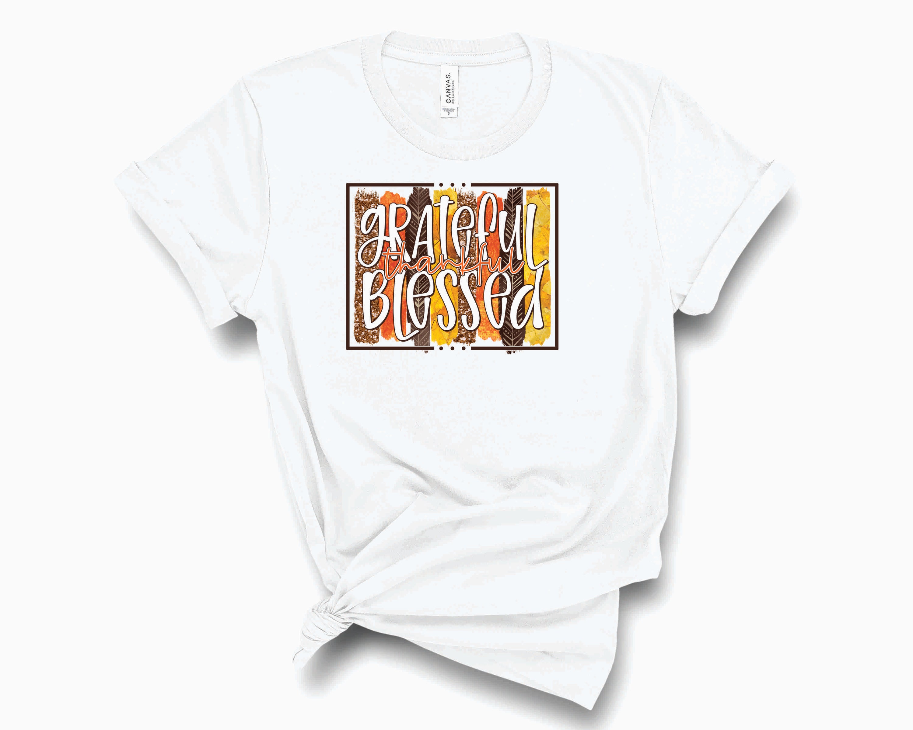 A unisex graphic tee featuring the words Grateful, Thankful, and Blessed in a stylish brush stroke design.