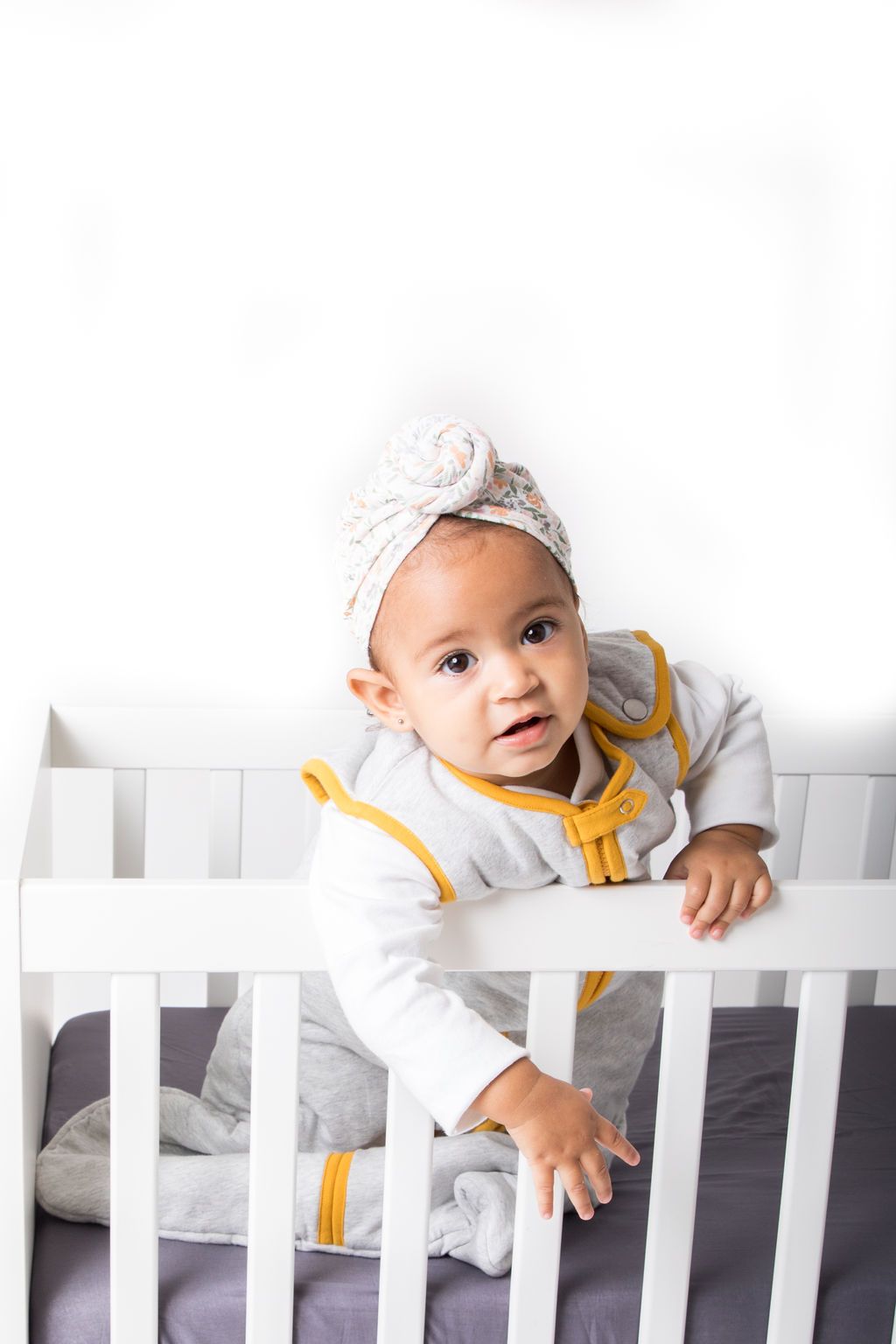 Greenwich Fitted Crib Sheet made of ultra-soft cotton voile, featuring concealed elastic for a snug fit and unique handcrafted design.