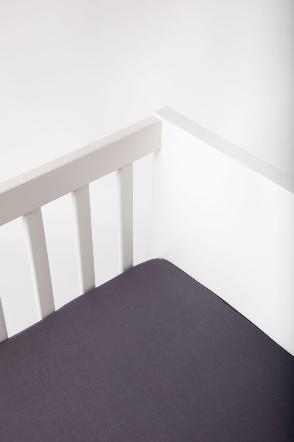 Greenwich Fitted Crib Sheet made of ultra-soft cotton voile, featuring concealed elastic for a snug fit and unique handcrafted design.