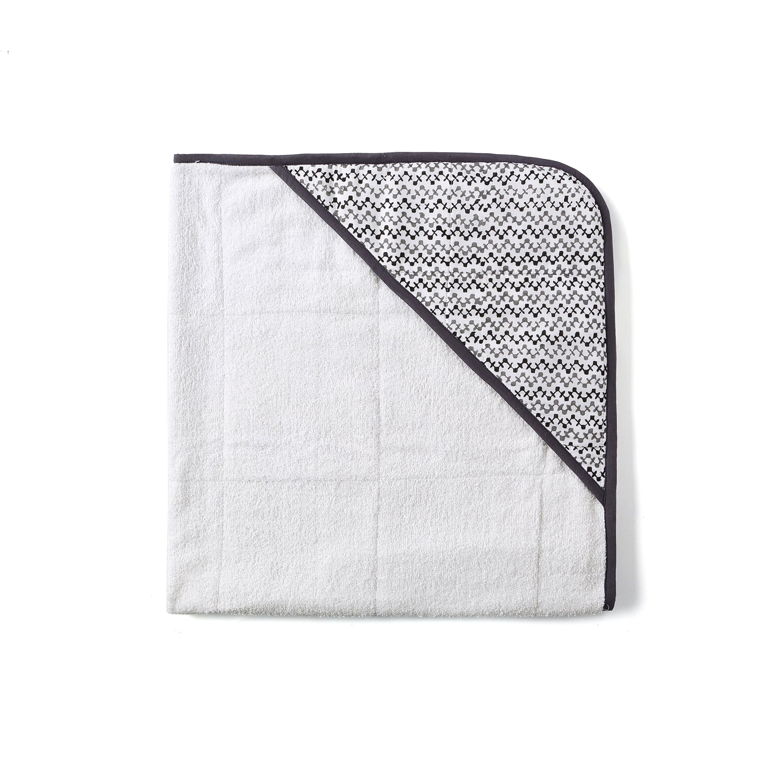 A beautifully designed GREENWICH TOWEL featuring soft cotton voile and plush terry, perfect for newborns to toddlers, with a unique handcrafted pattern.