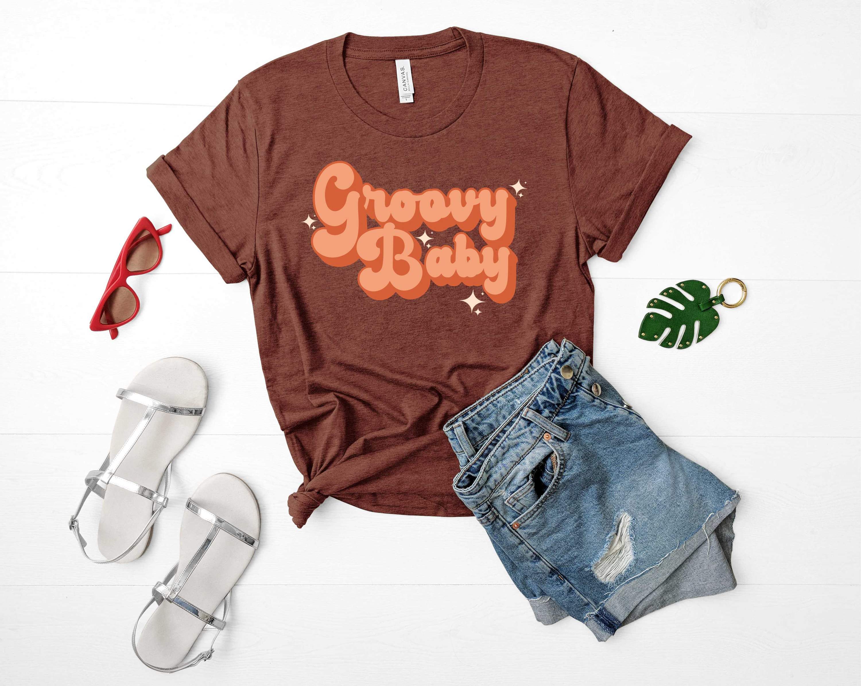 Groovy Baby Graphic Tee featuring a vibrant design on a soft fabric, perfect for casual wear.