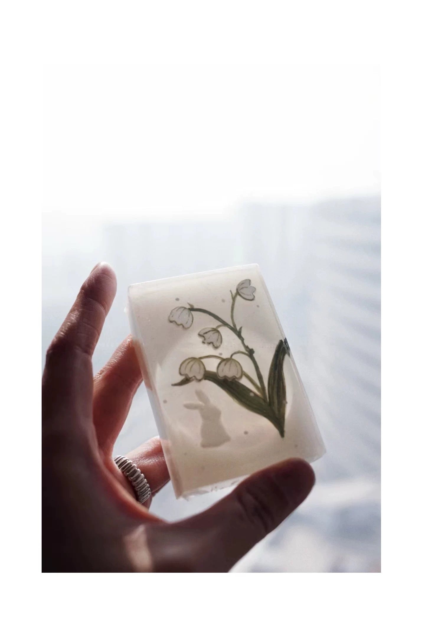 A beautifully crafted bar of Handmade Lily of the Valley Aromatic Soap, showcasing its delicate floral design and rich texture, perfect for luxurious bathing.