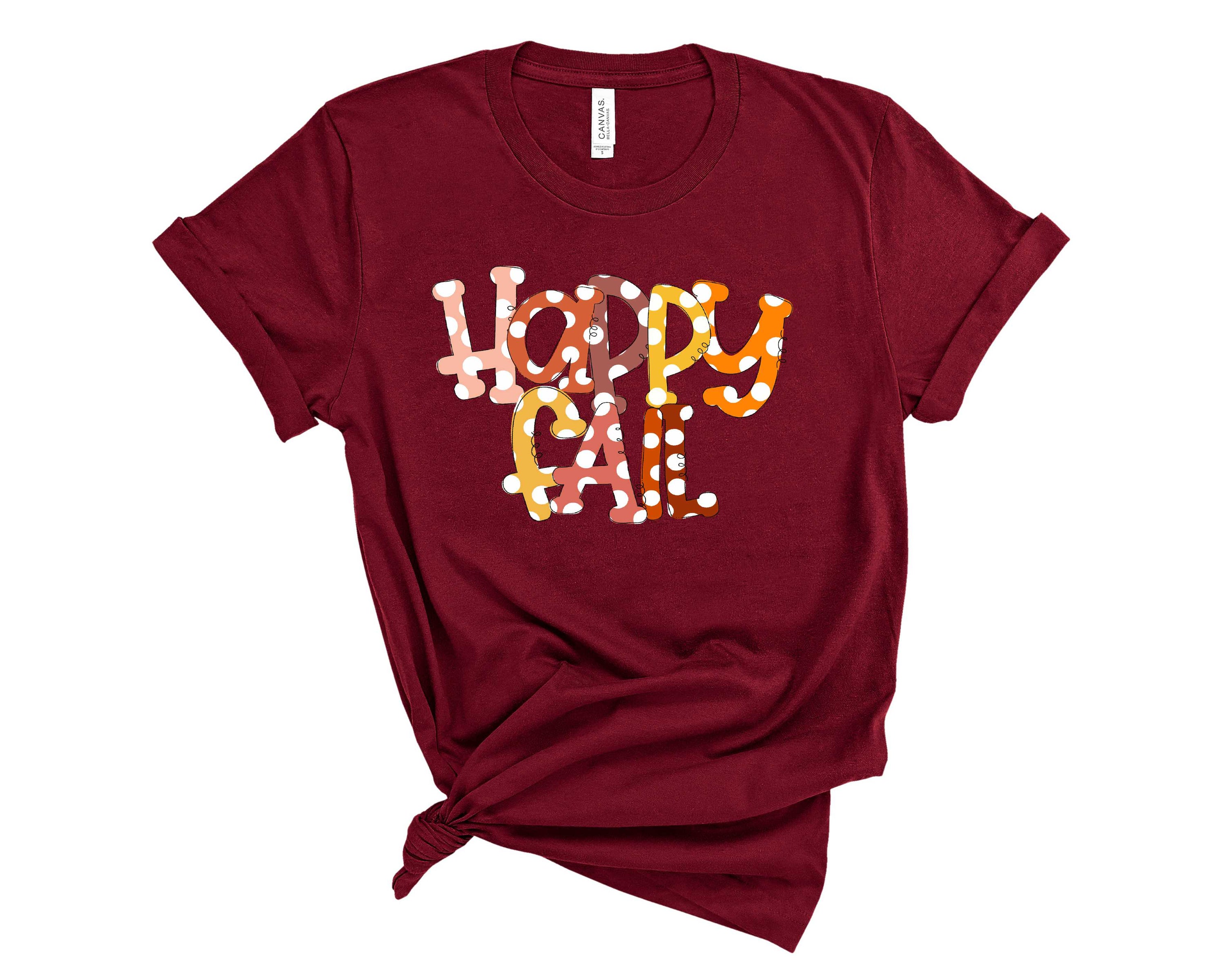 Happy Fall Dots Graphic Tee featuring a vibrant autumn-themed design on a soft unisex t-shirt.