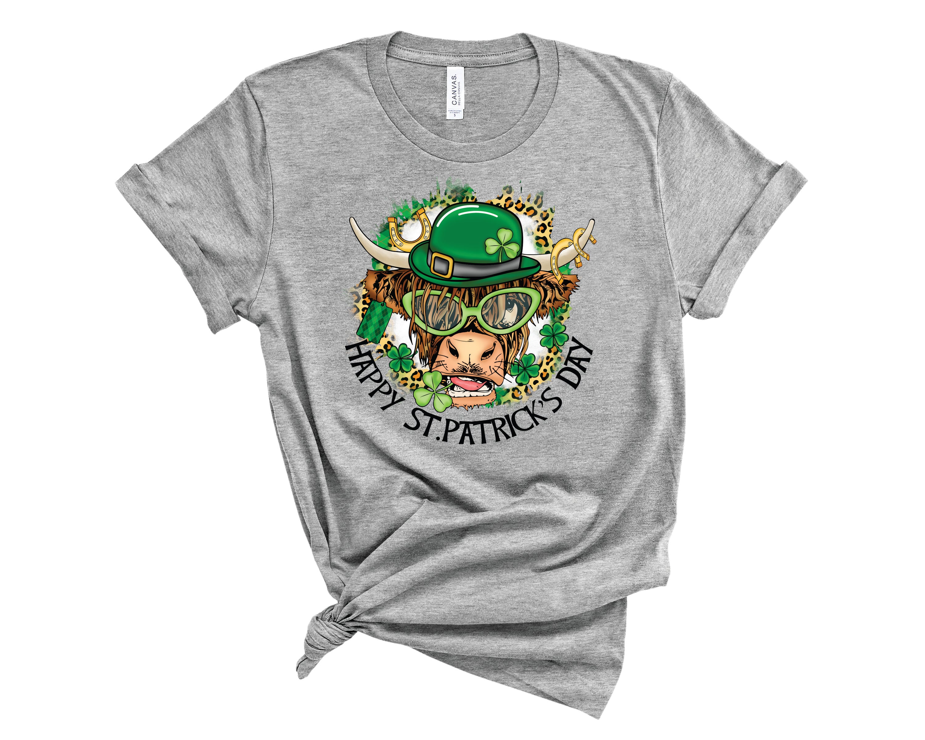 Happy St. Patrick's Day Cow graphic tee featuring a cheerful cow design, perfect for festive celebrations.
