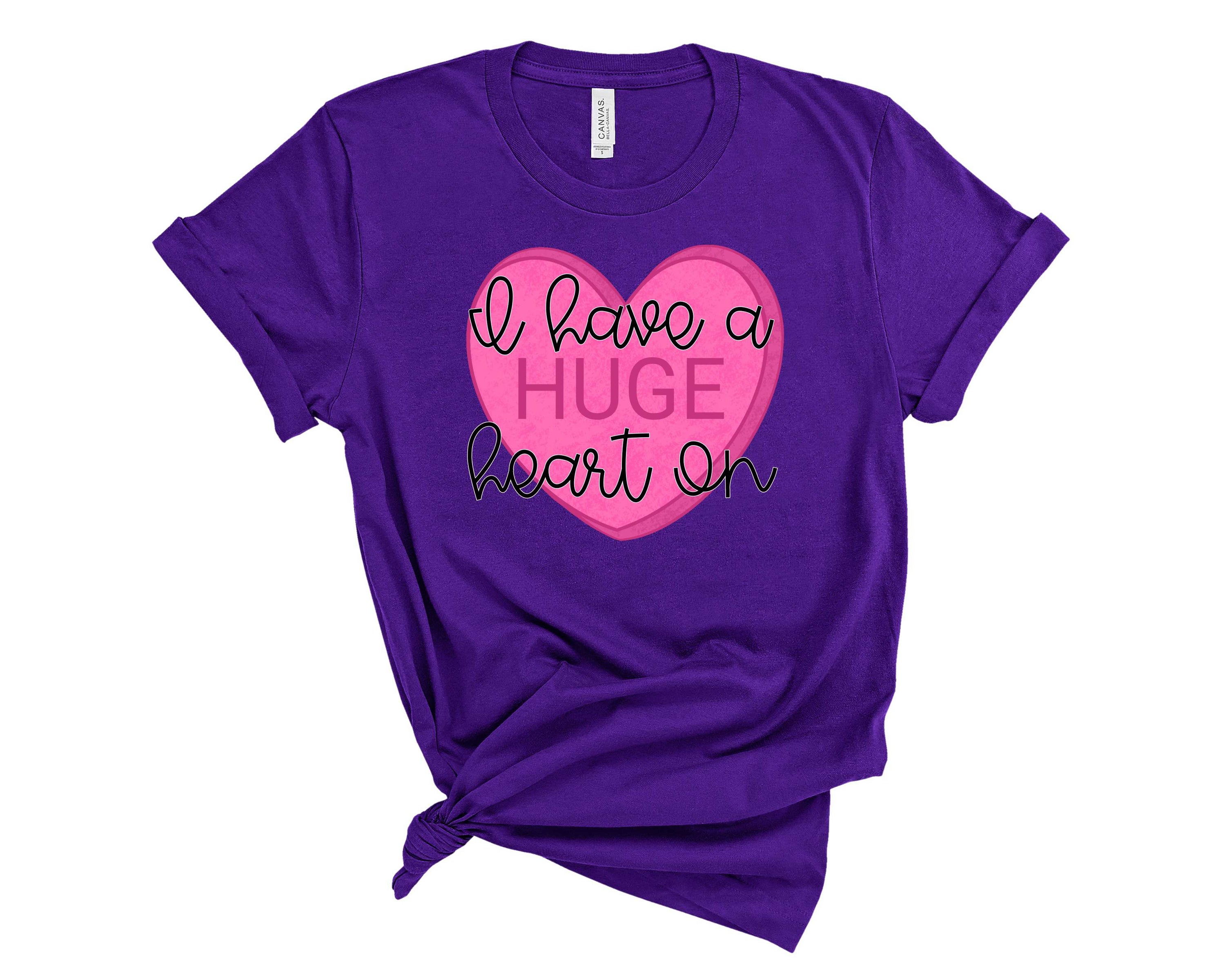 A stylish unisex Heart On Graphic Tee featuring a vibrant heart design, perfect for casual wear.