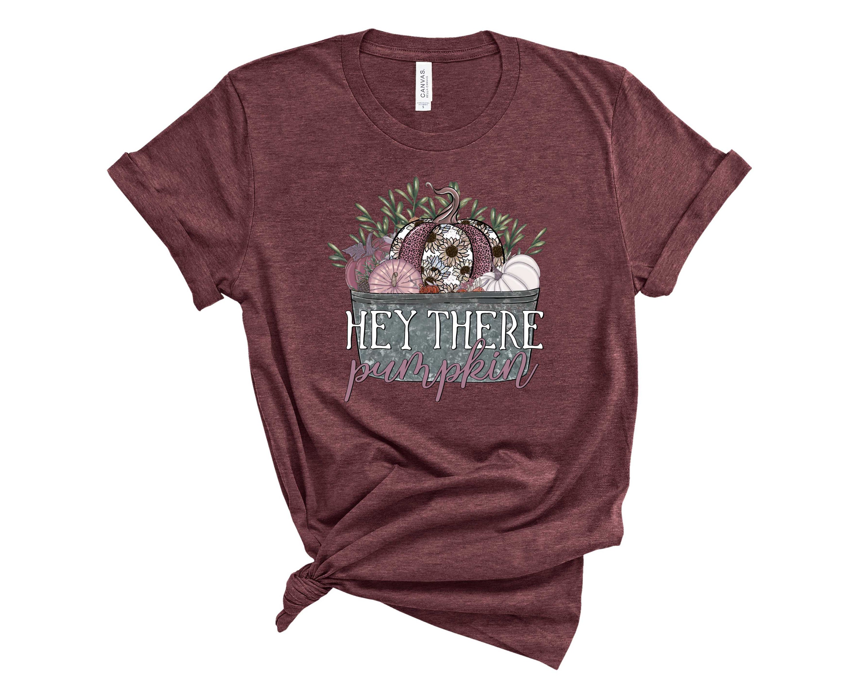 Hey There Pumpkin graphic tee featuring a vibrant pumpkin design on a soft unisex t-shirt.
