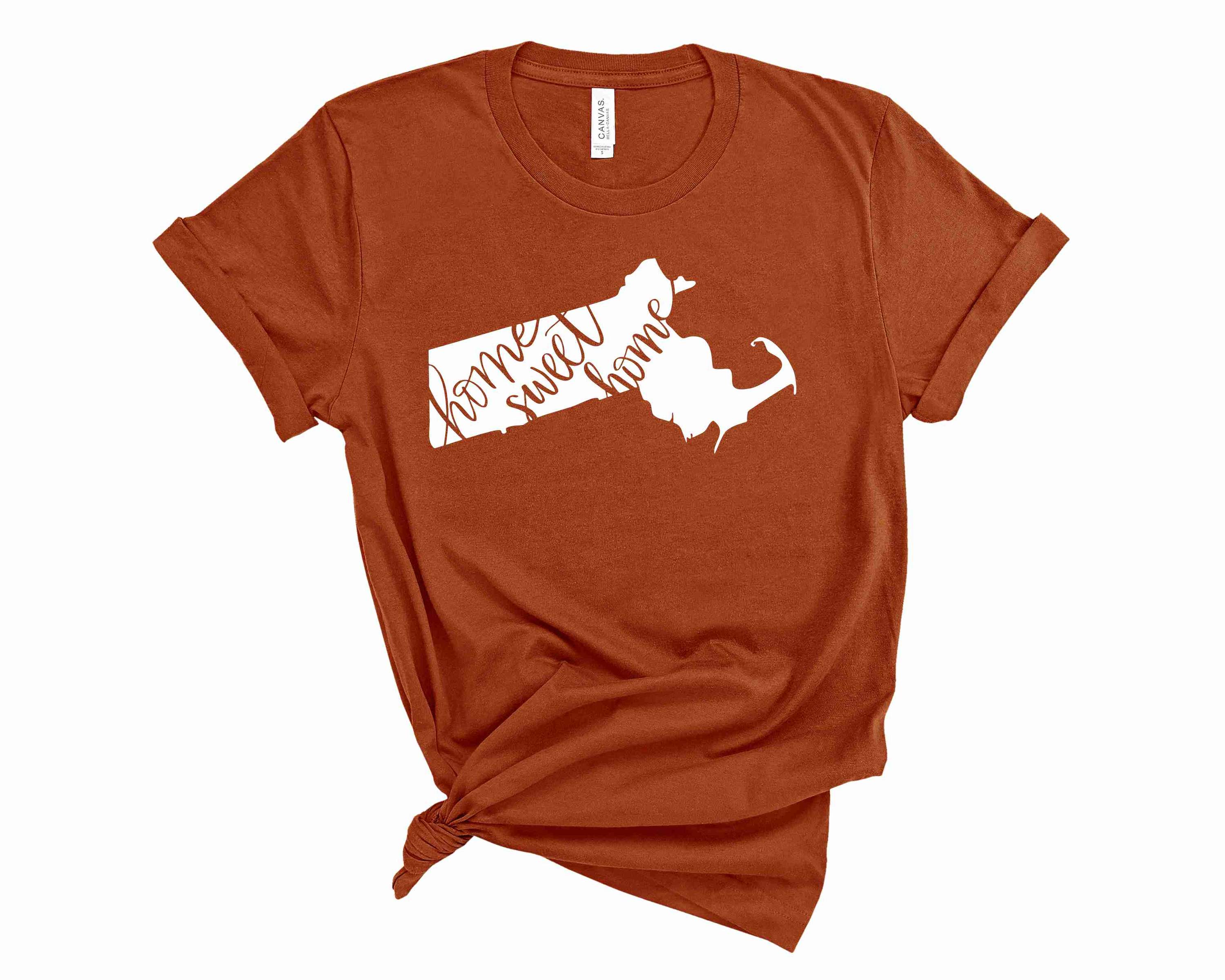 A unisex graphic tee featuring the phrase 'Home Sweet Home Massachusetts' in bold letters, showcasing a stylish design.
