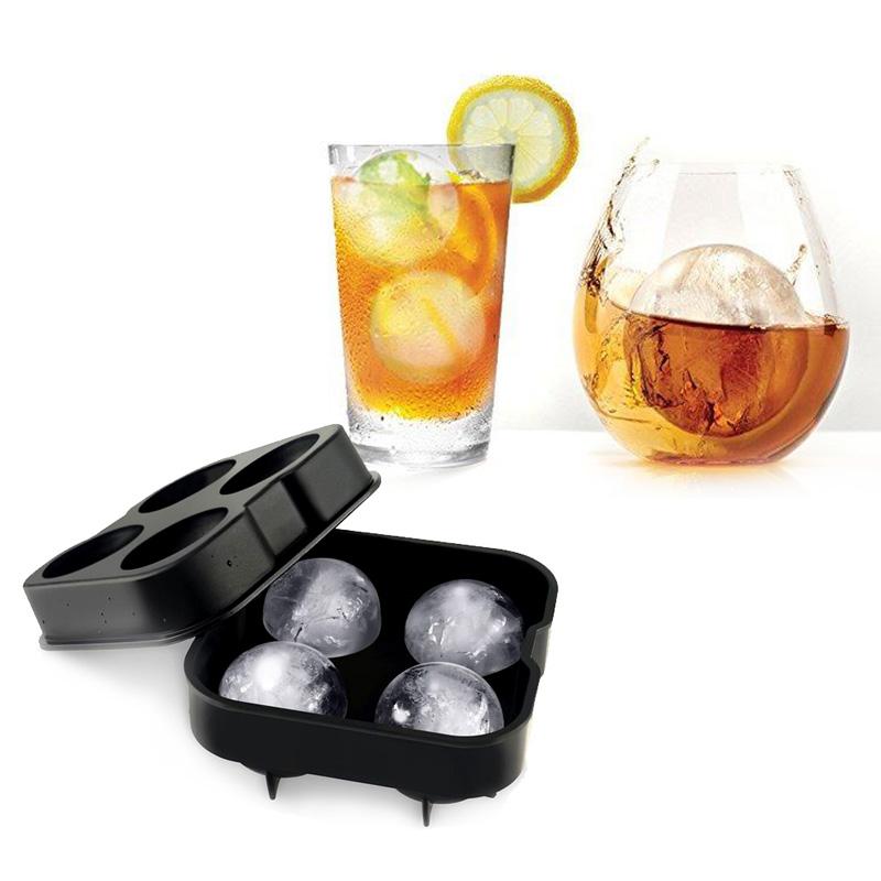 Silicone Ice Sphere Mold creating four round ice spheres for cocktails, showcasing elegant design and functionality.